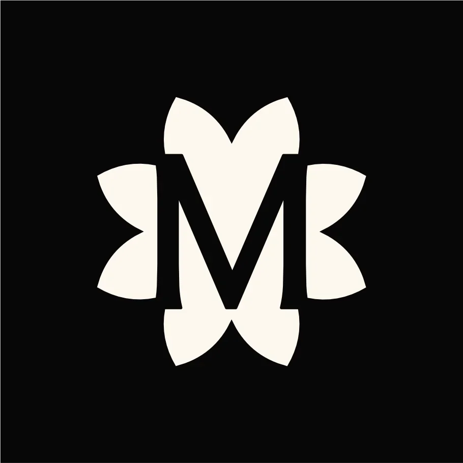 A black and white logo featuring a butterfly with a large letter 'M' in the center.