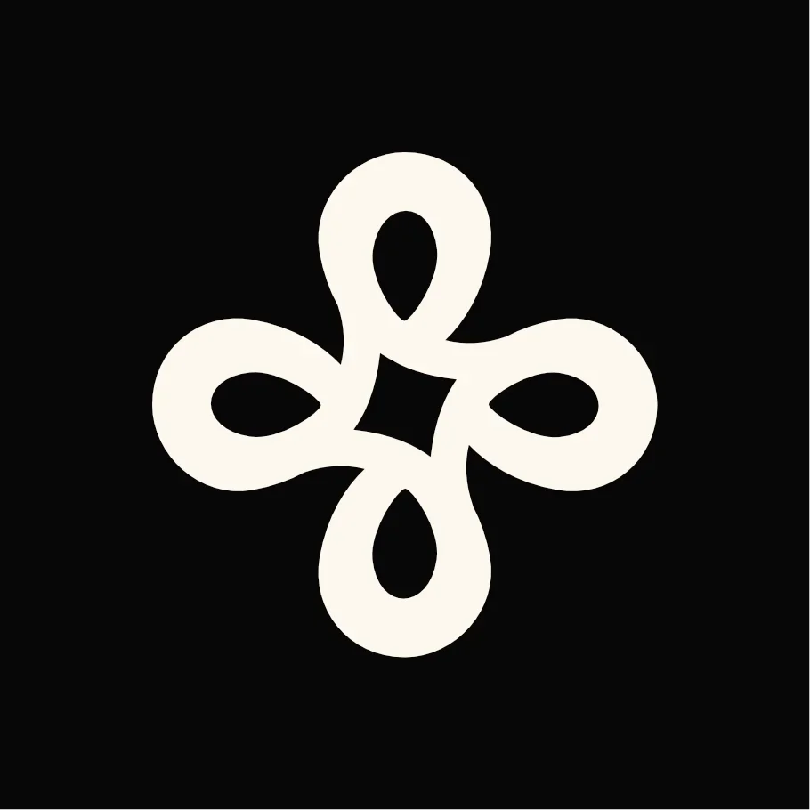 A white, stylized geometric pattern resembling a flower or star on a black background.