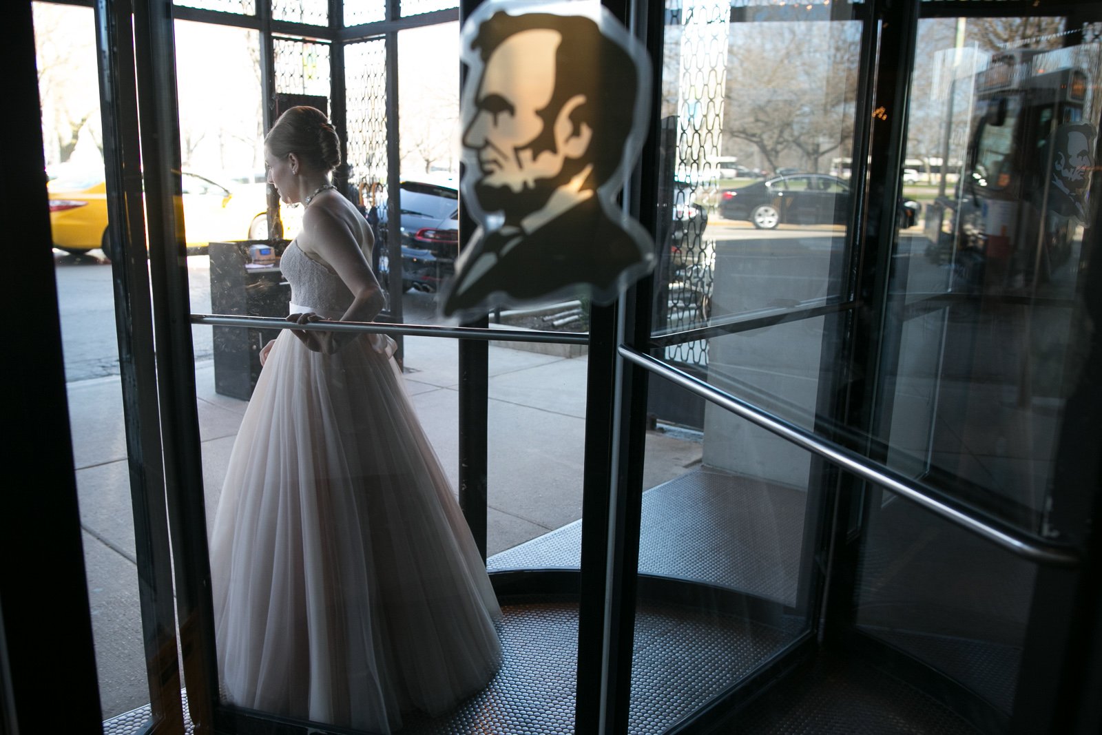 bride walking out the door Lincoln Hotel wedding photography