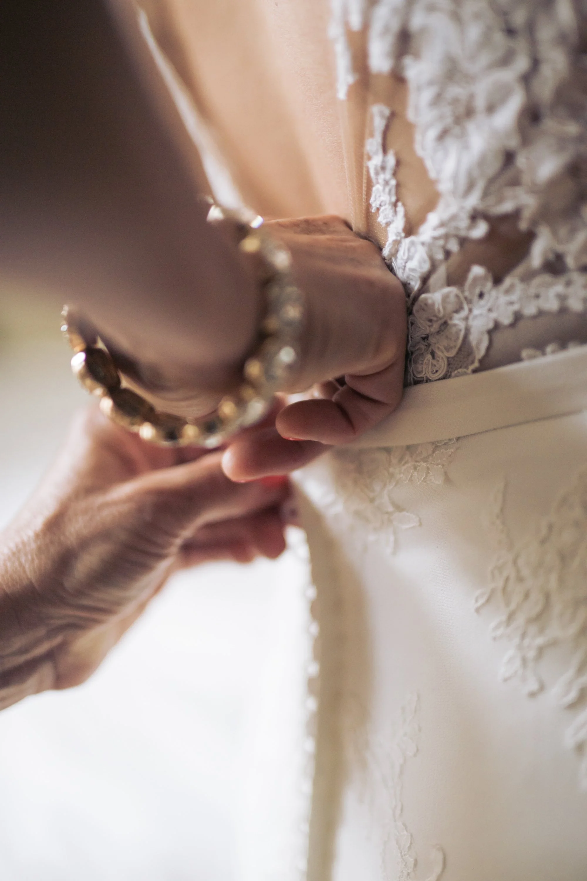 bride dress getting dressed wedding photographer near me 