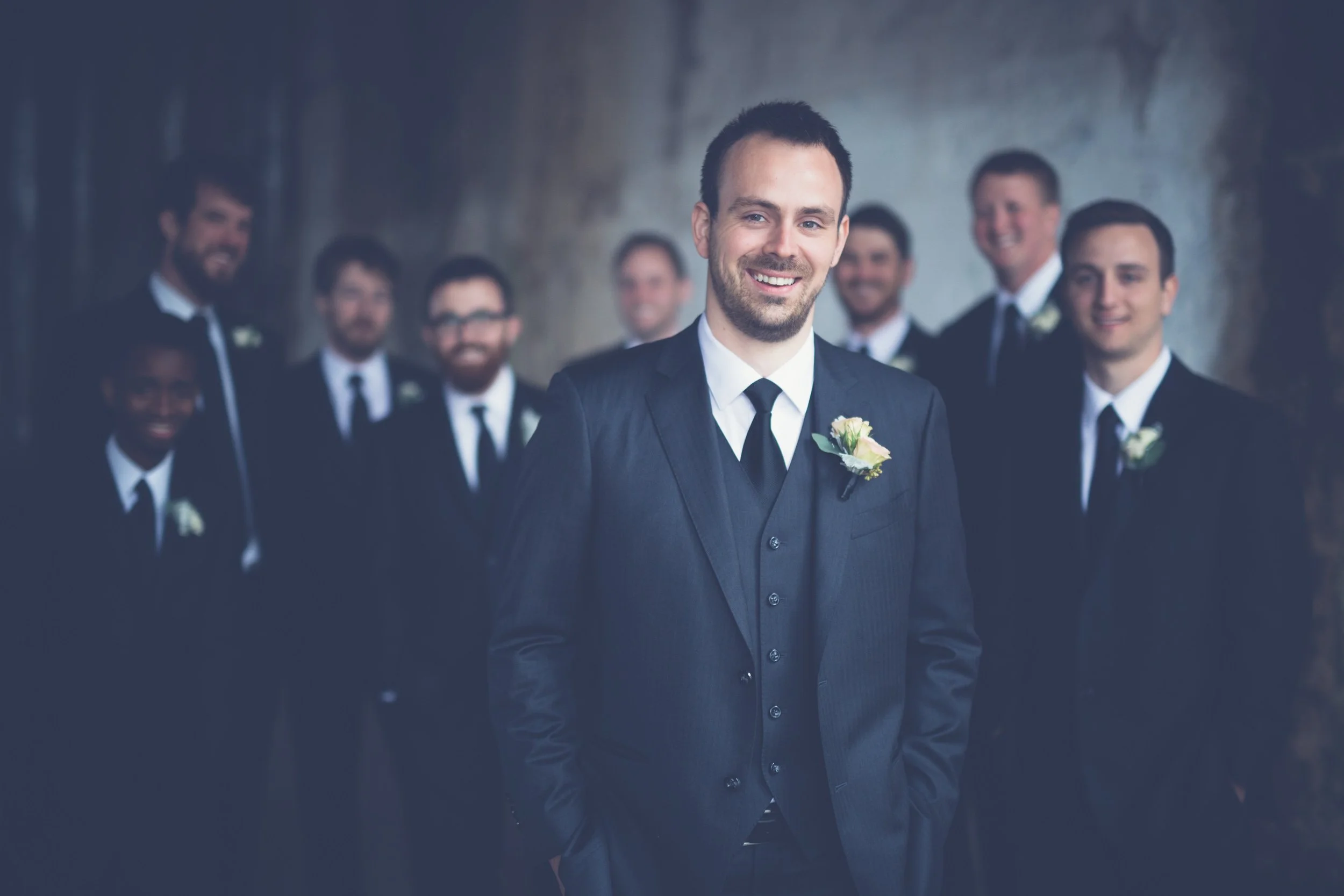 groom with groomsmen with umbrellas Lyric Opera House Chicago Wedding photographer near me