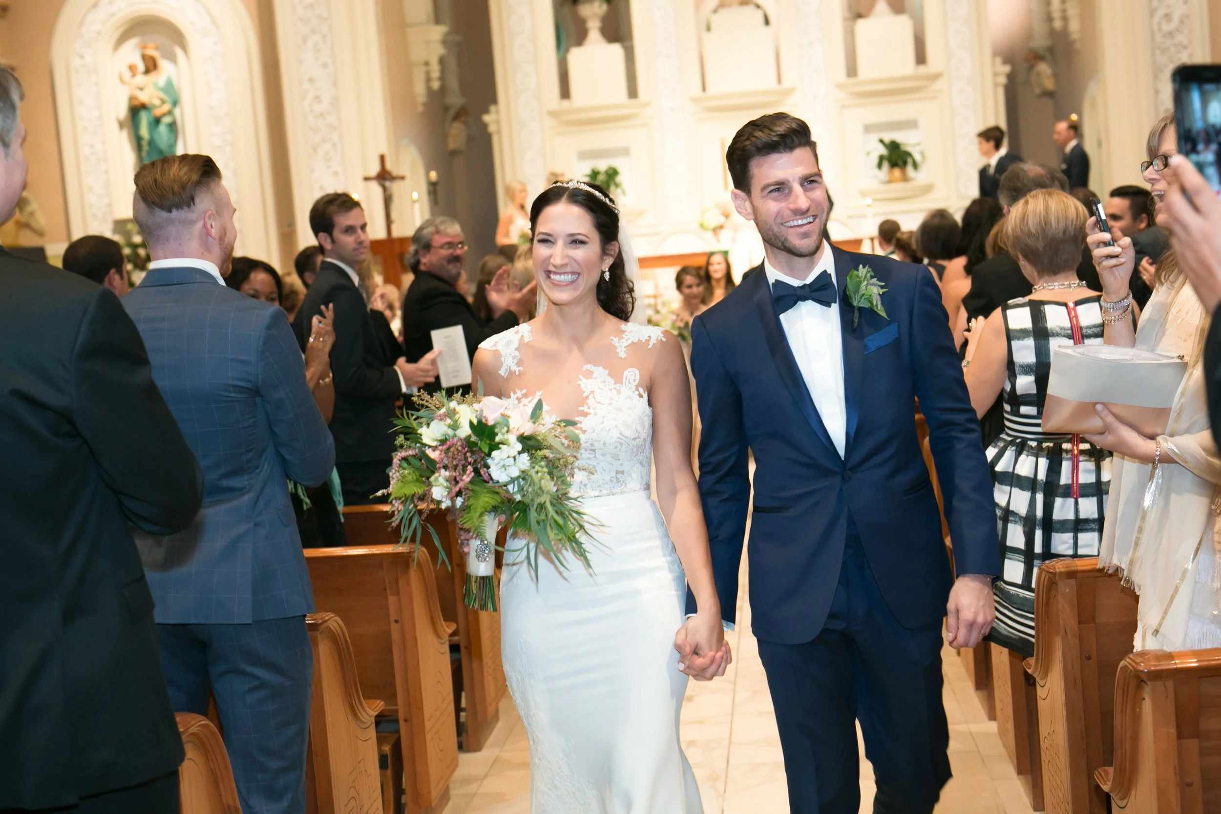 bride and groom first kiss at ceremony Chicago wedding photographer near me