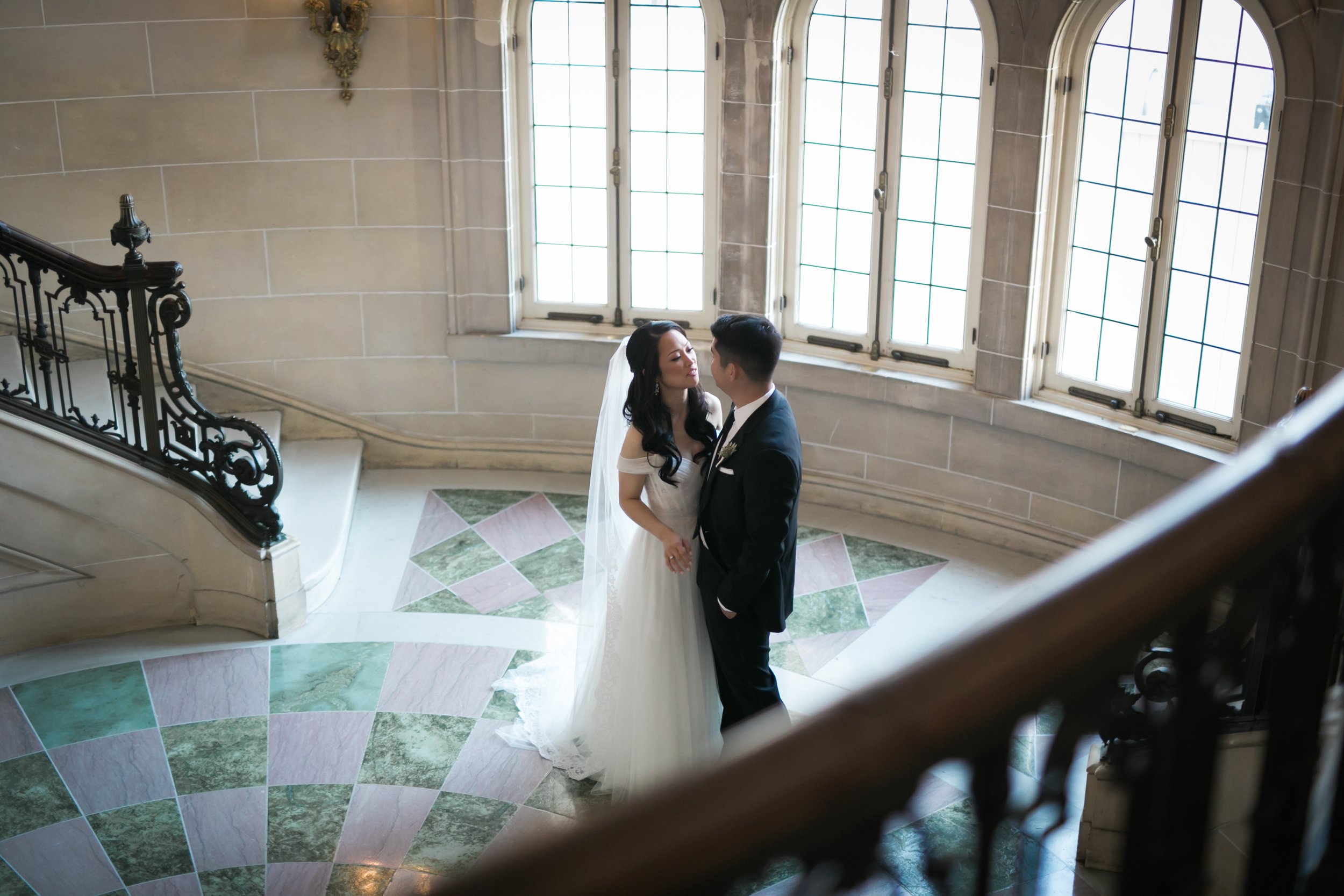 Bride walking down stairs before ceremony wedding photography