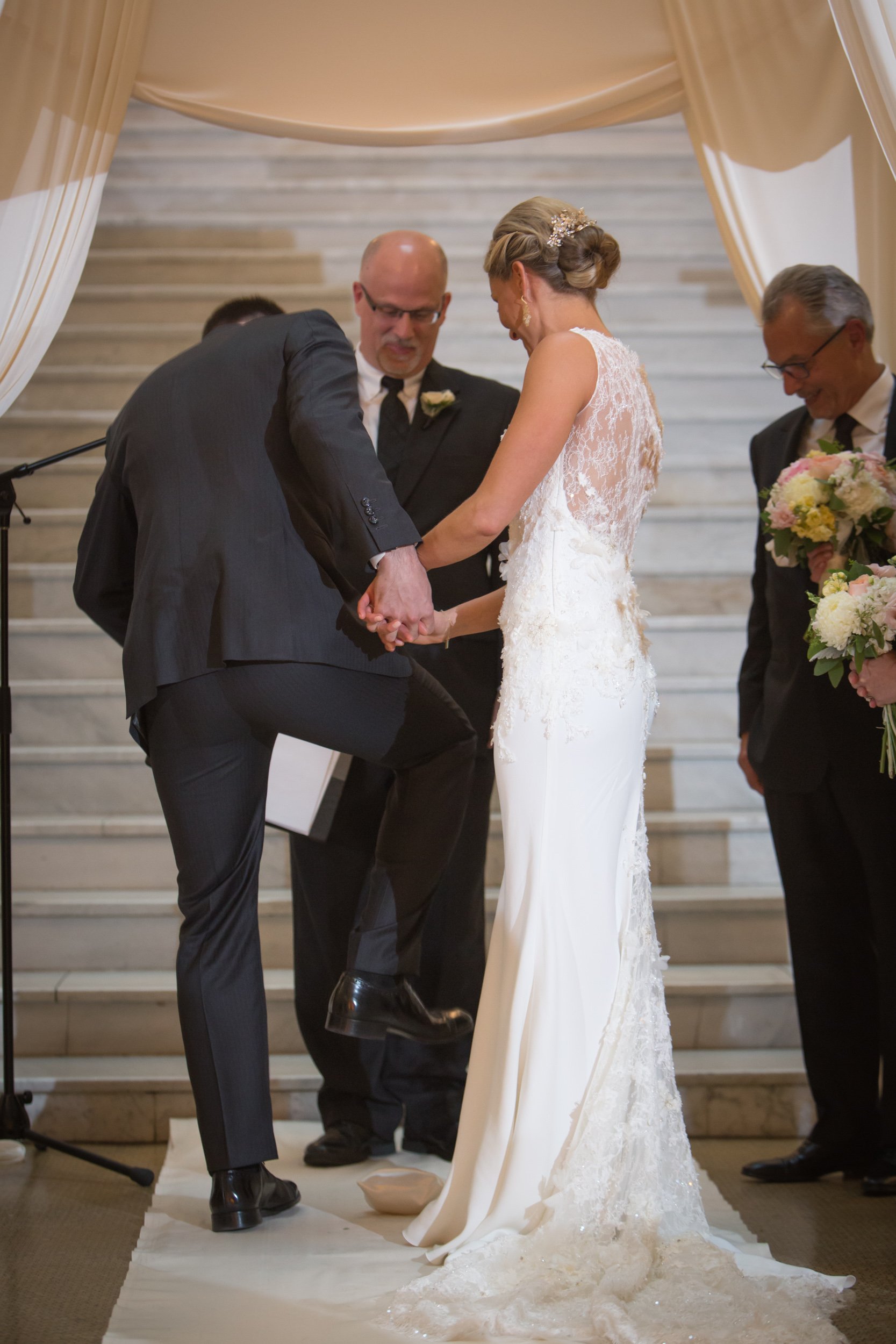 groom smashing glass wedding jewish ceremony Chicago wedding photographer near me