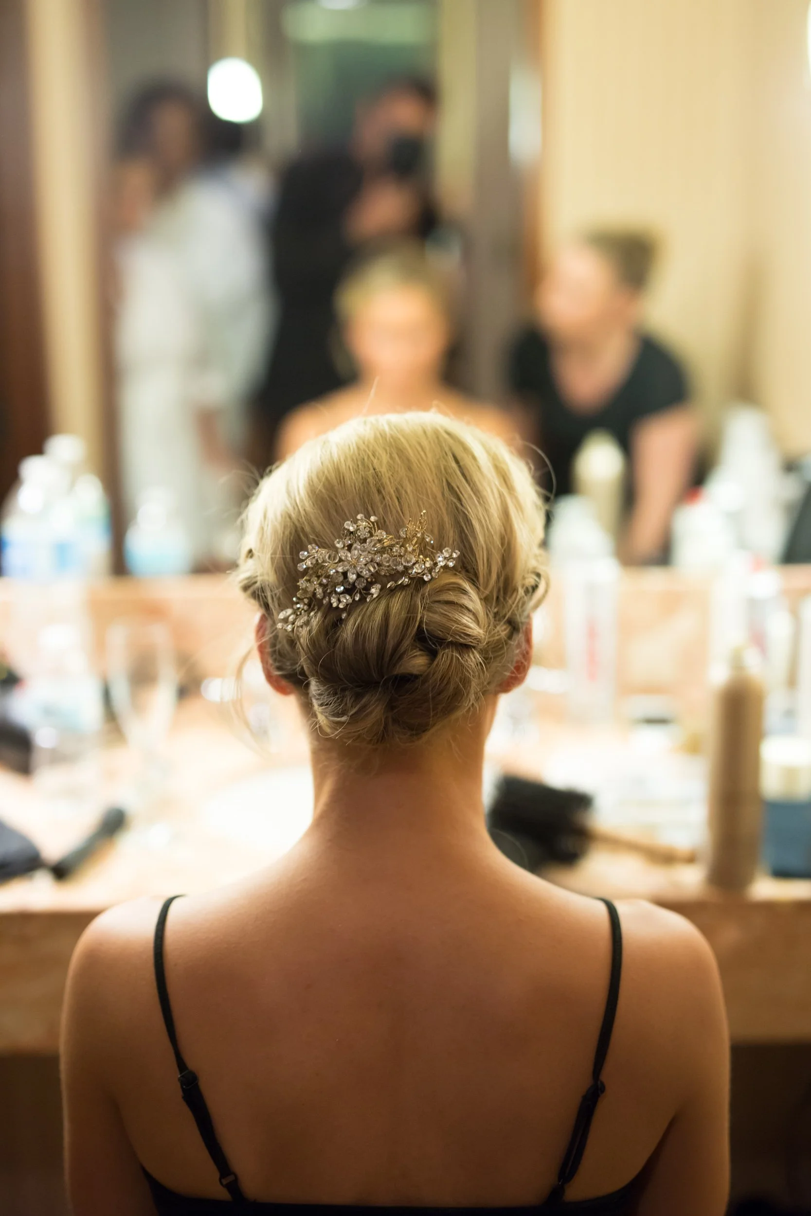 bride getting her hair done Chicago wedding photographer near me