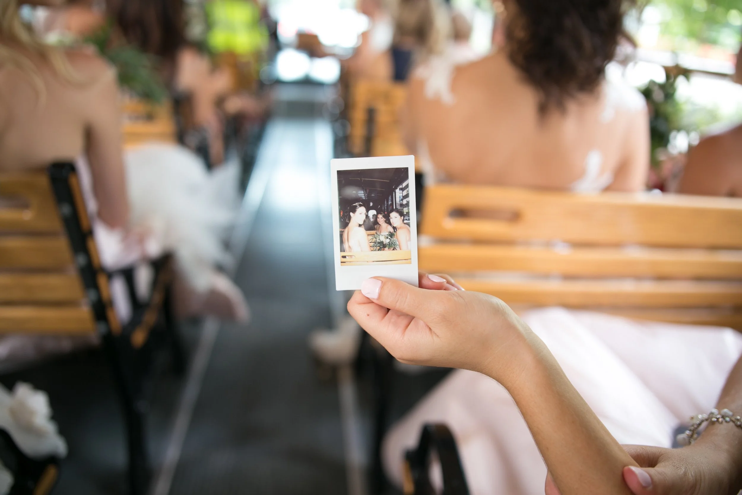 bride in trolley going to ceremony wedding photographer in Chicago 
