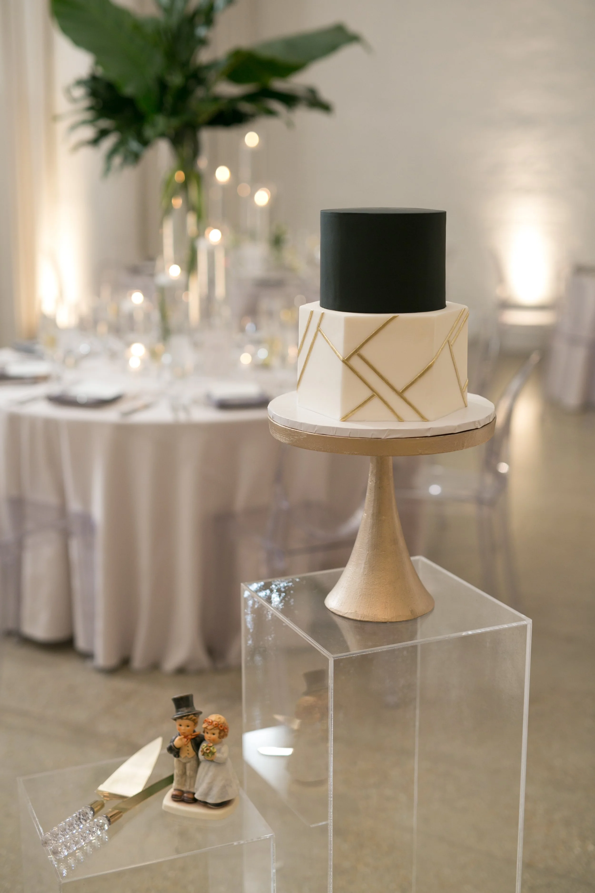 wedding reception wedding cake flowers in background Chicago wedding photography near me 