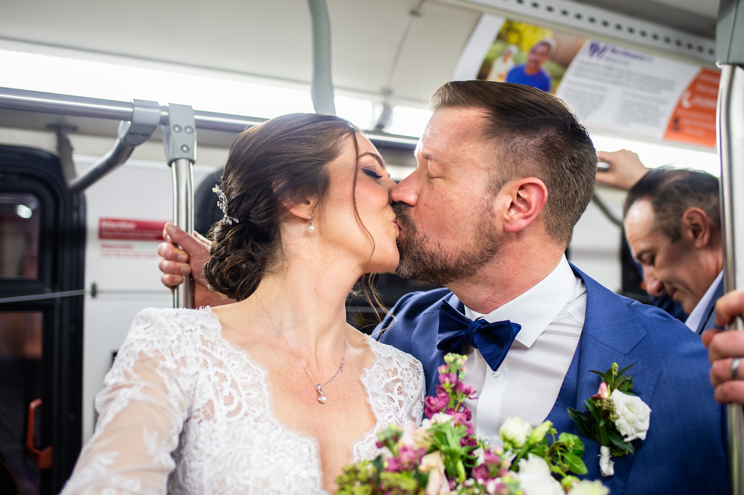 Bride groom kissing on subway wedding photo