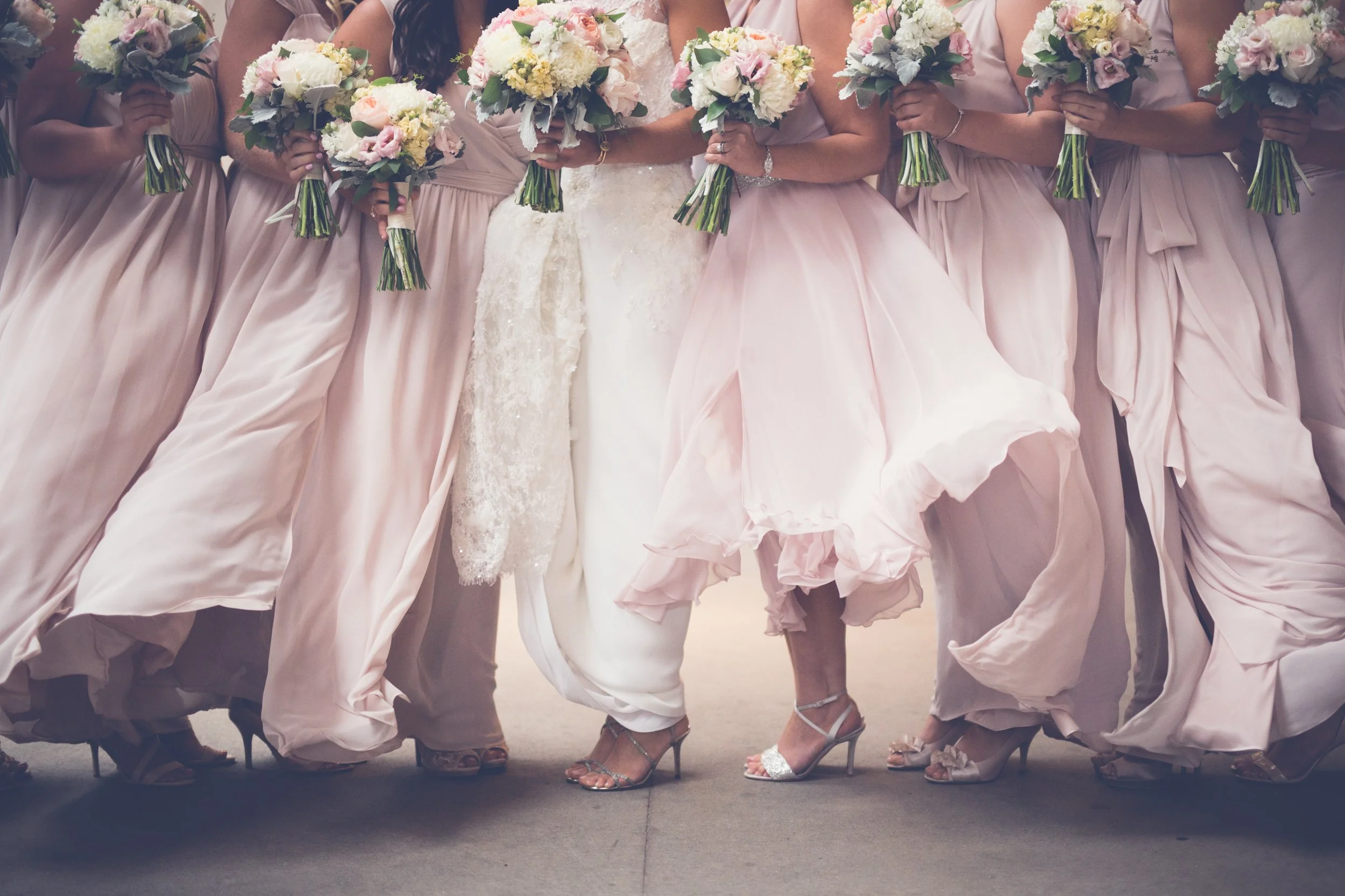 bride with her bridesmaids in the rain windy brrrr Lyric opera House Chicago wedding photography