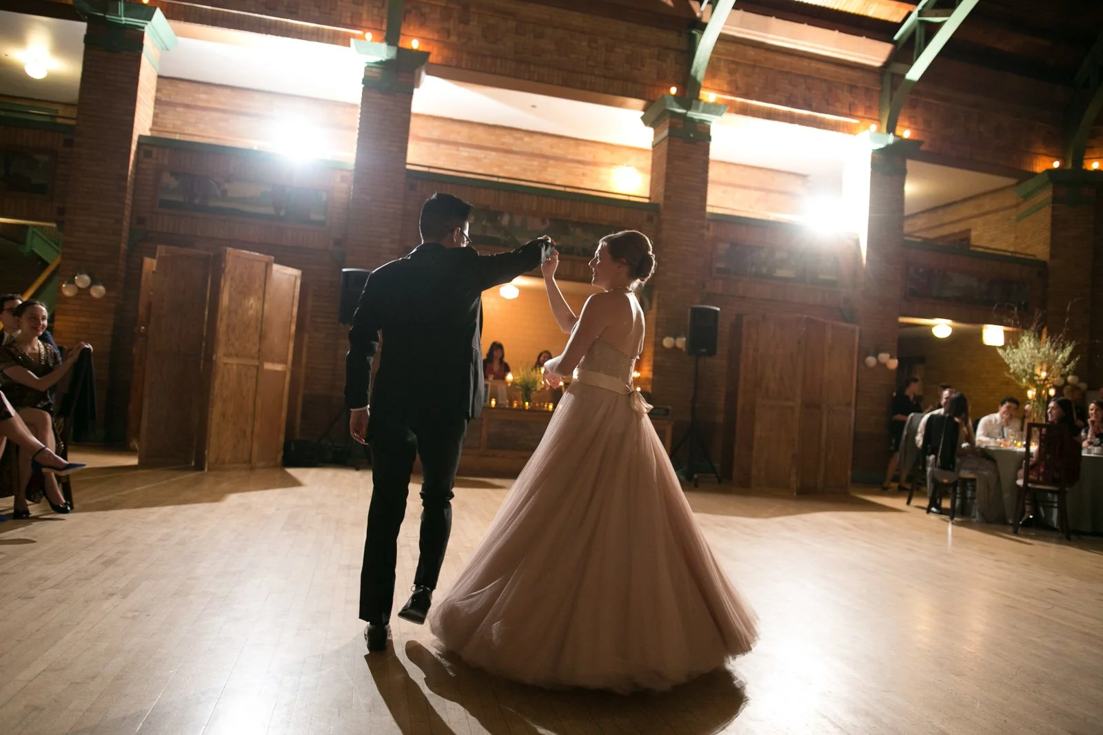 bride and groom first dance wedding reception wedding photographer near me 