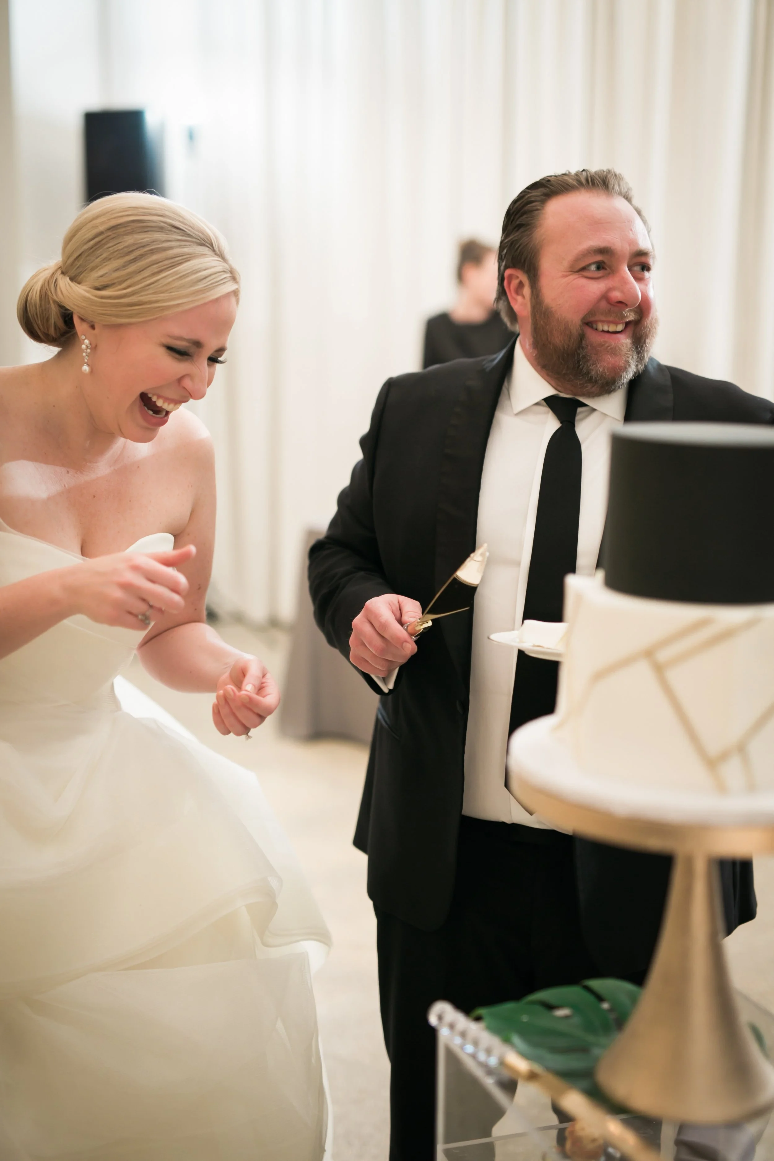 bride and groom cutting cake at reception Chicago wedding photographer near me 