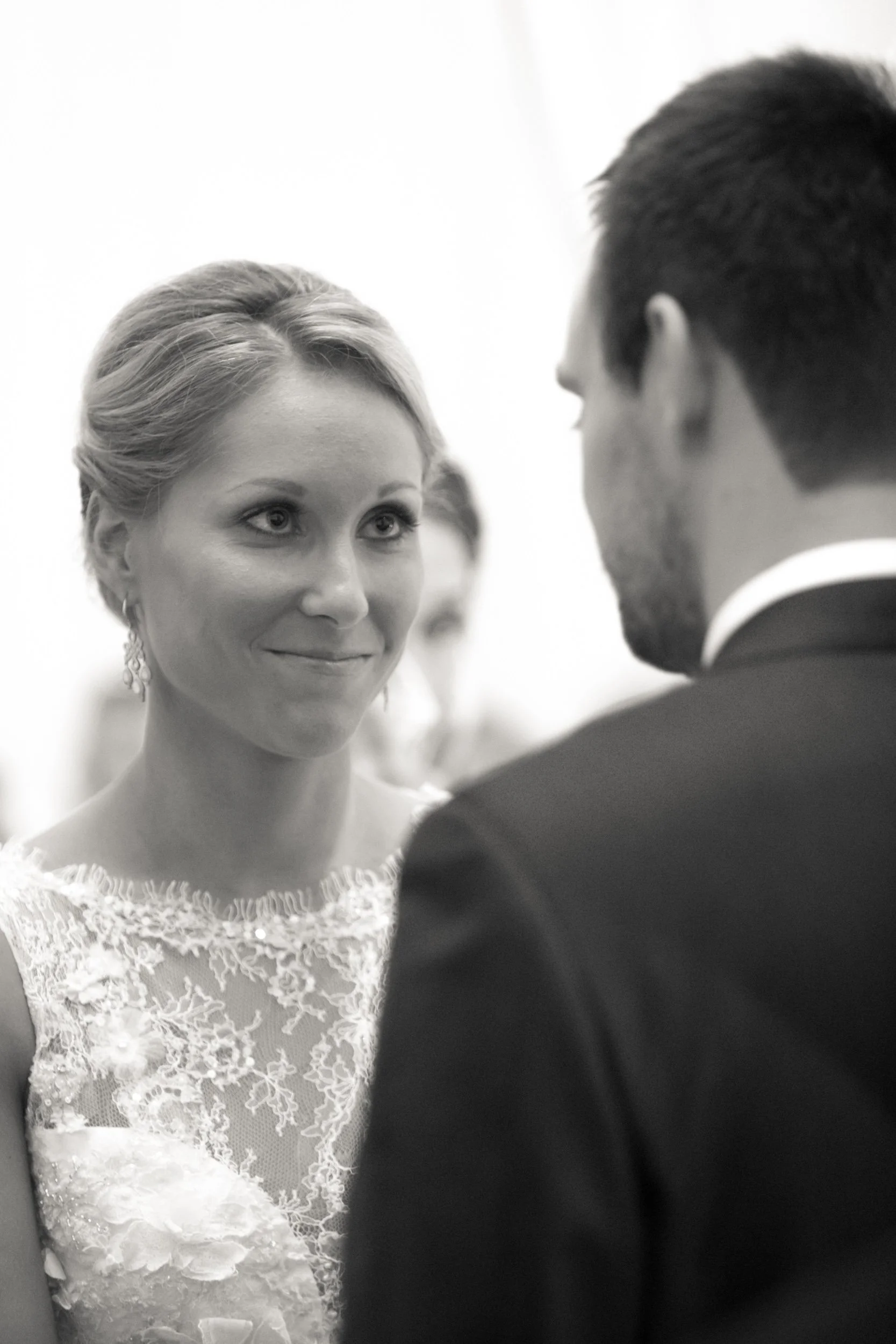 bride looking at her groom smiling wedding ceremony Chicago wedding photographers near me 