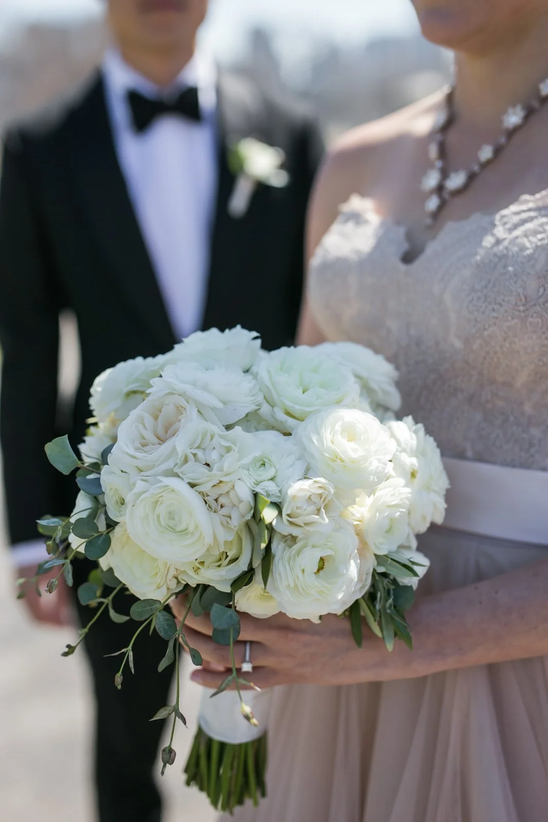 groom tux with flower corsage bride with bouquet chicago lincoln park pond wedding photography near me 