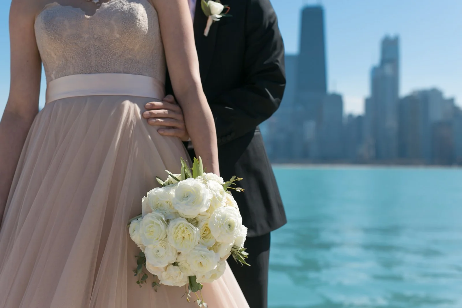 groom standing with bride with bouquet north avenue beach lake michigan wedding photography near me 