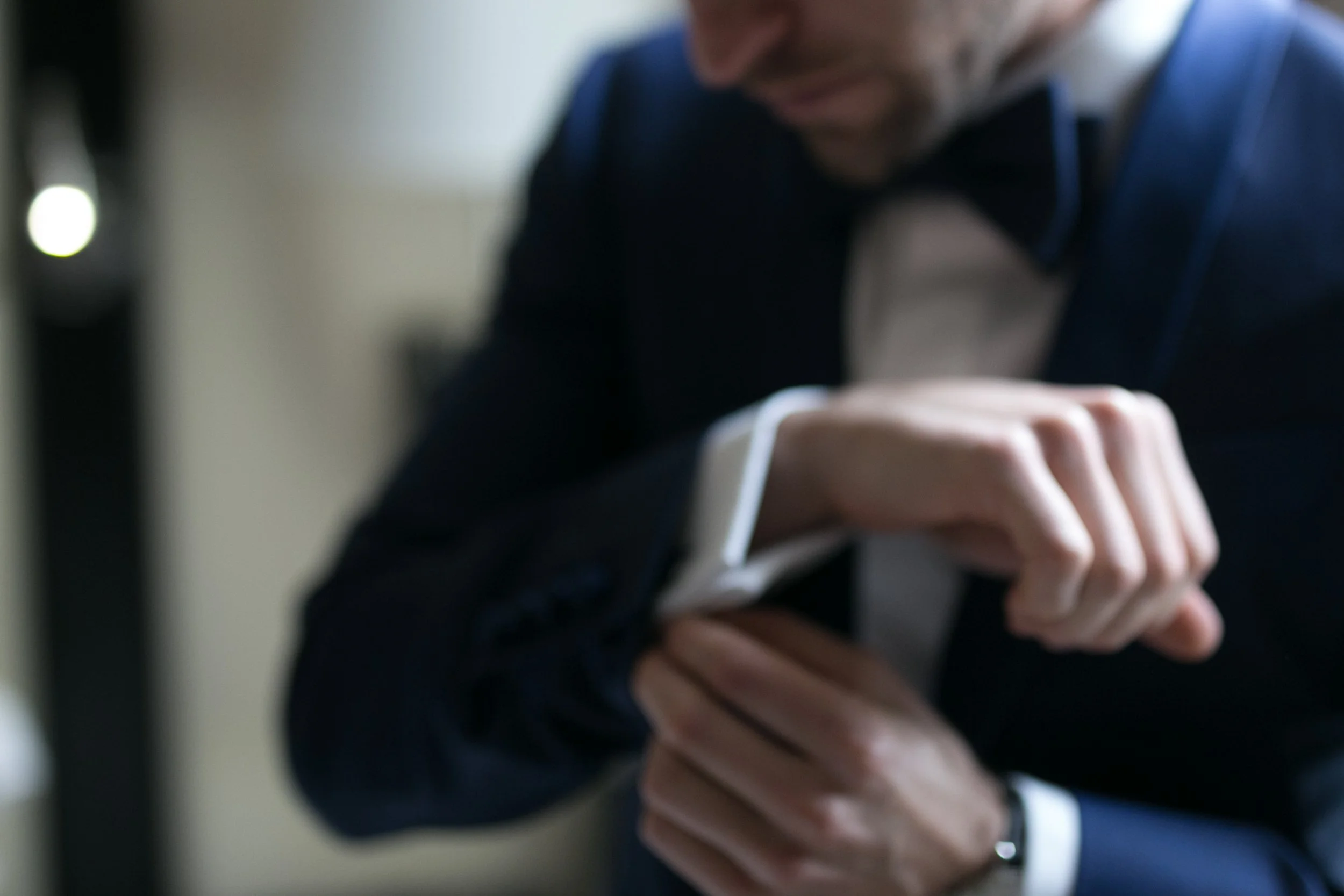 groom with best man cufflinks wedding photographer near me 