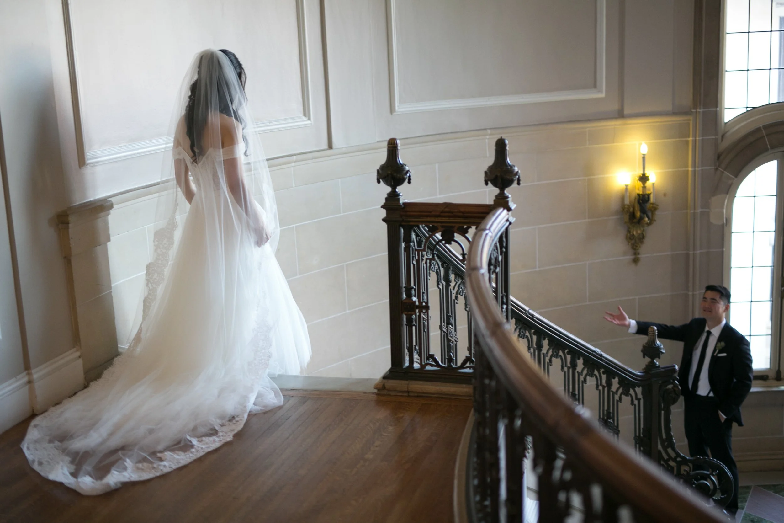 Bride walking down stairs before ceremony wedding photography