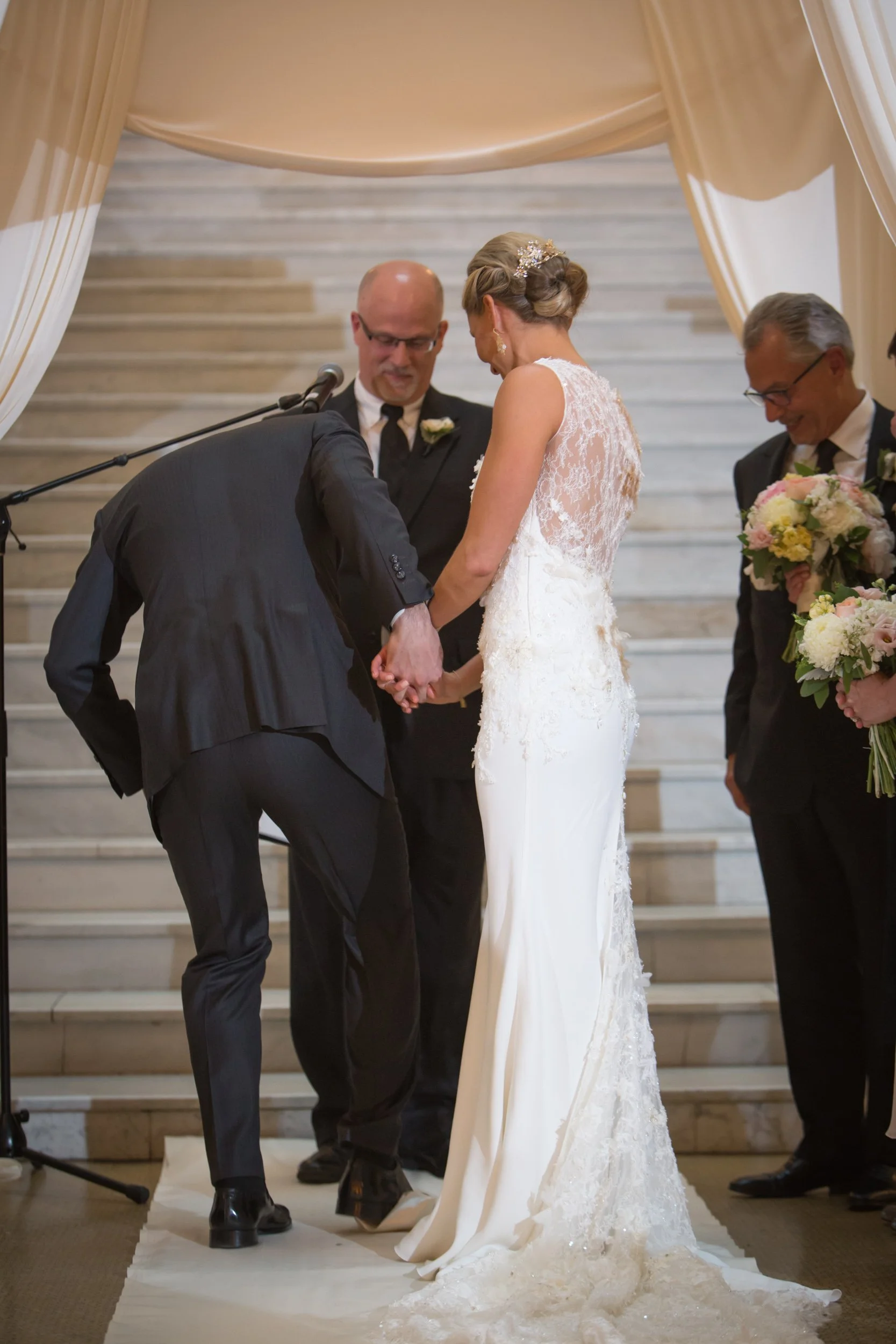 groom smashing glass wedding jewish ceremony Chicago wedding photographer near me