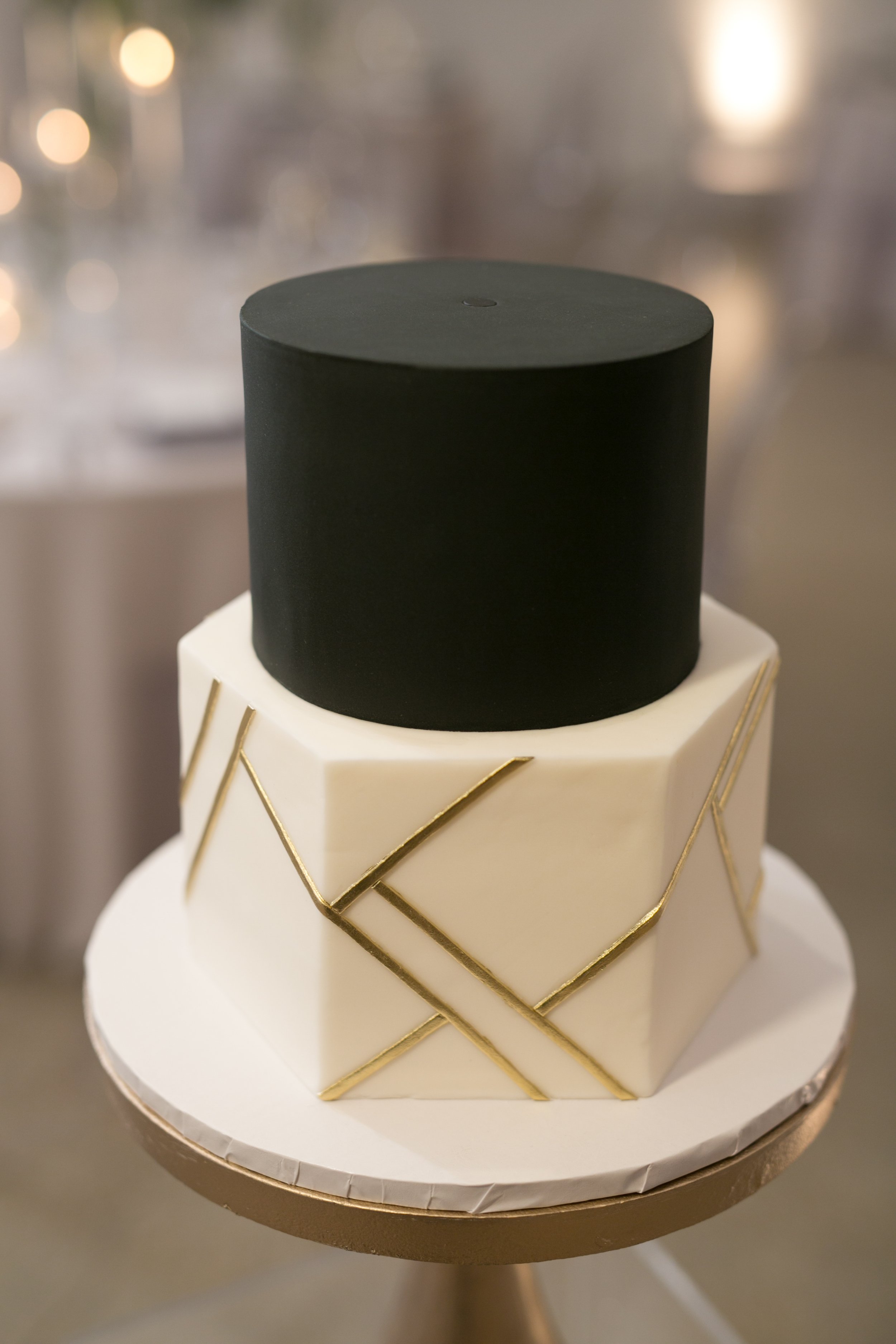 wedding reception wedding cake flowers in background Chicago wedding photography near me 