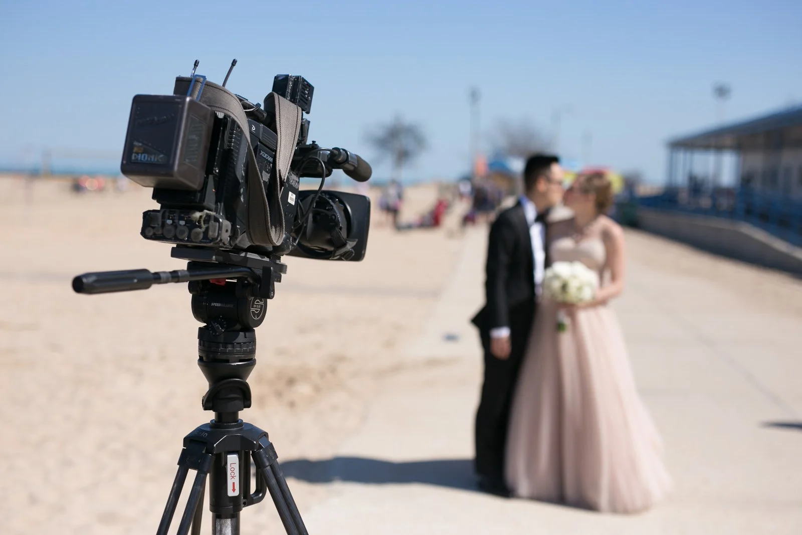 groom kissing bride with bouquet north avenue beach lake michigan wedding photography near me 