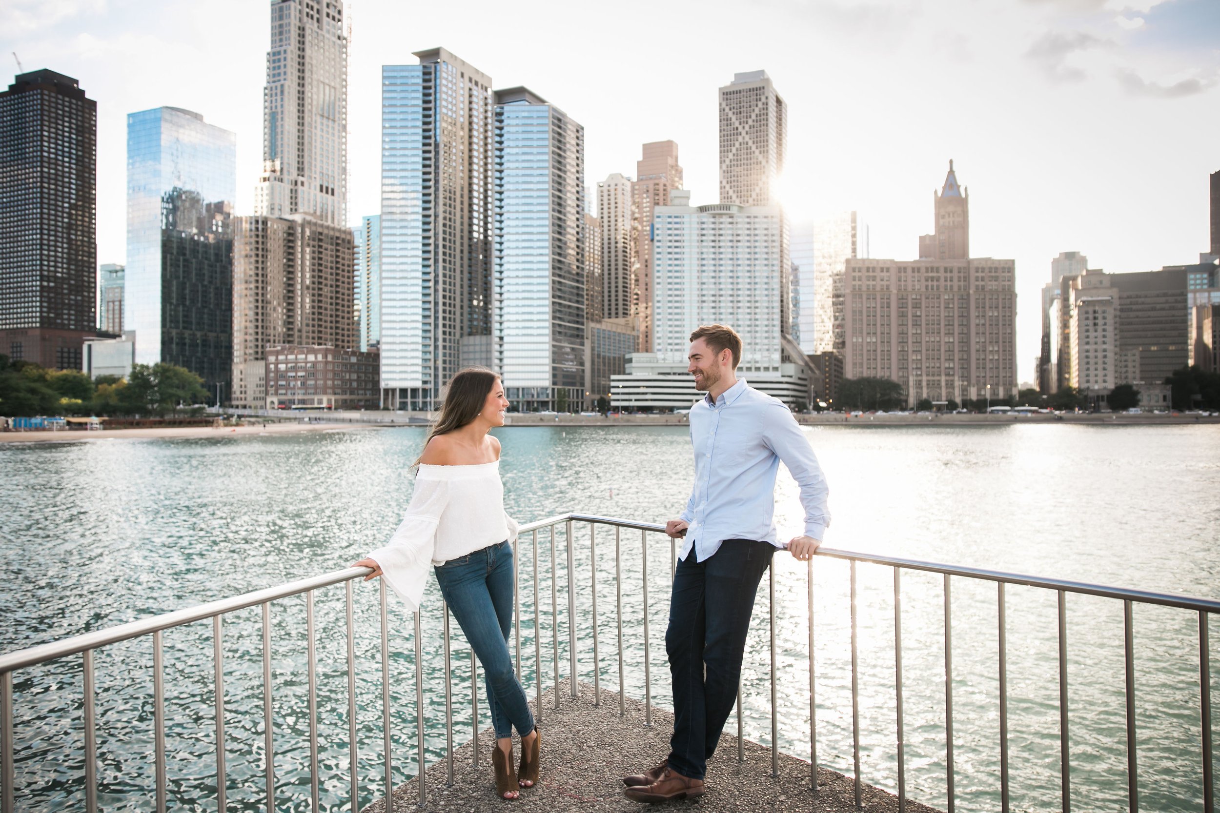 Candid engagement session wedding photography inspiration in Olive park with a Chicago skyline view 2