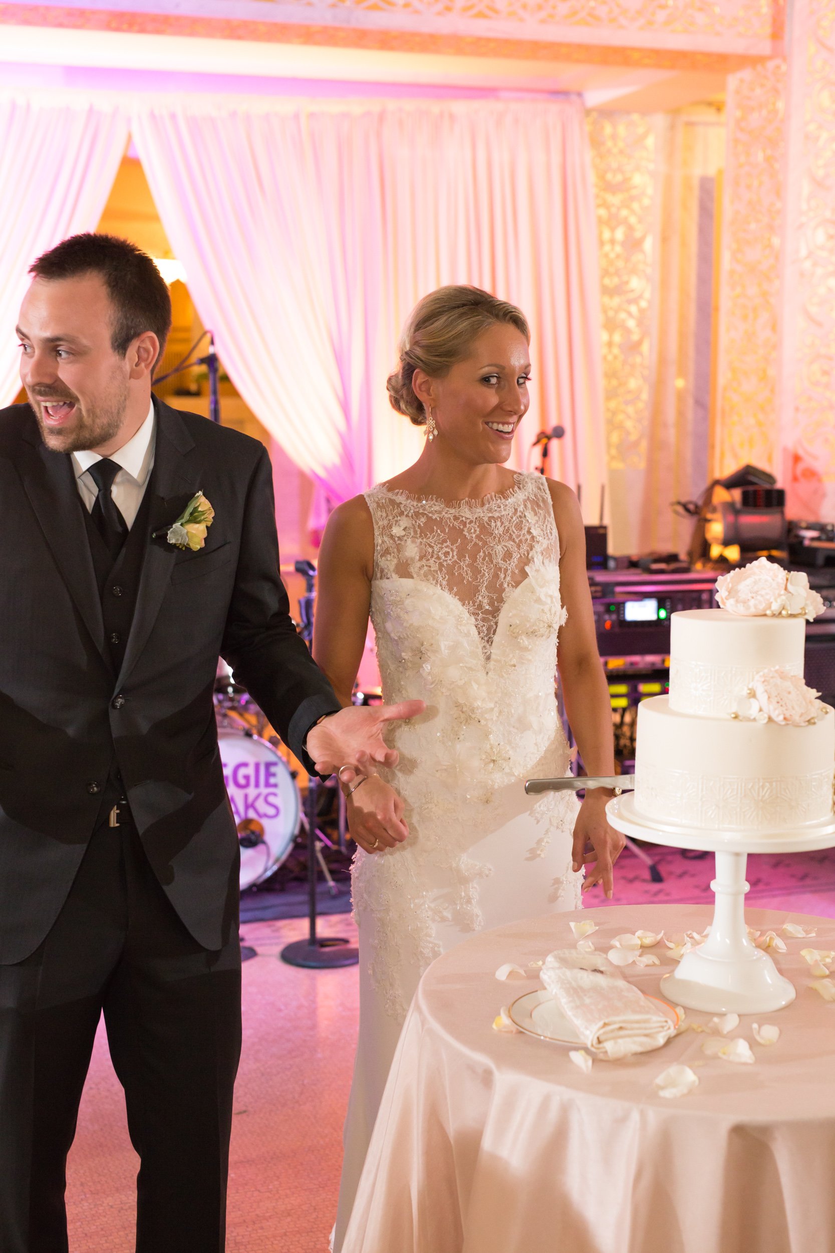 groom cutting cake Chicago wedding photographers near me 