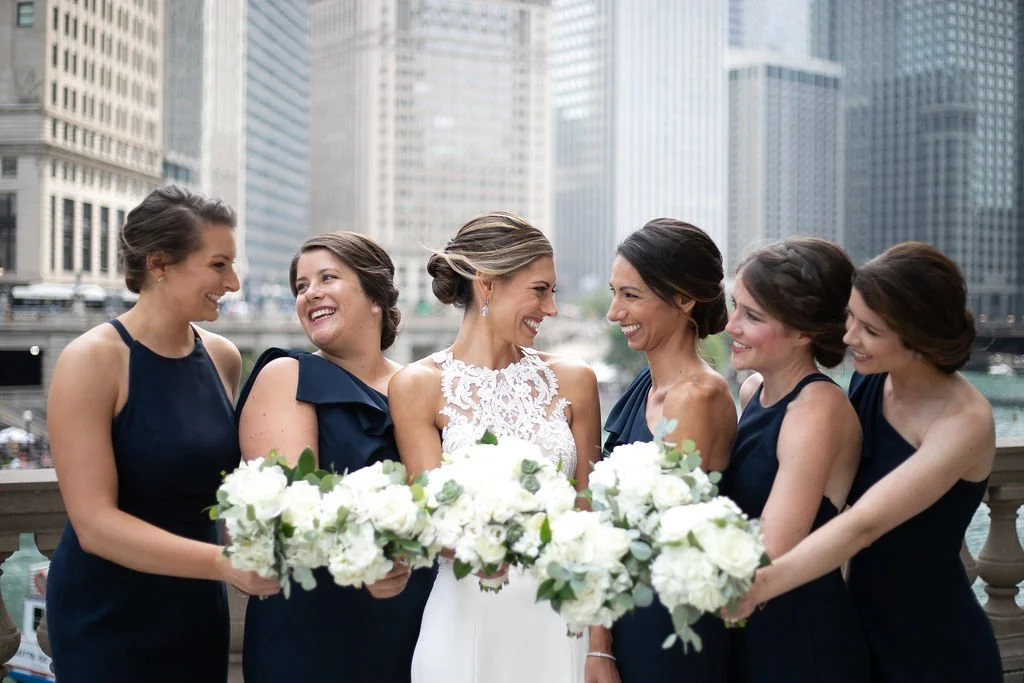 Bride smiling at bridesmaids for the wedding photographer in Downtown Chicago