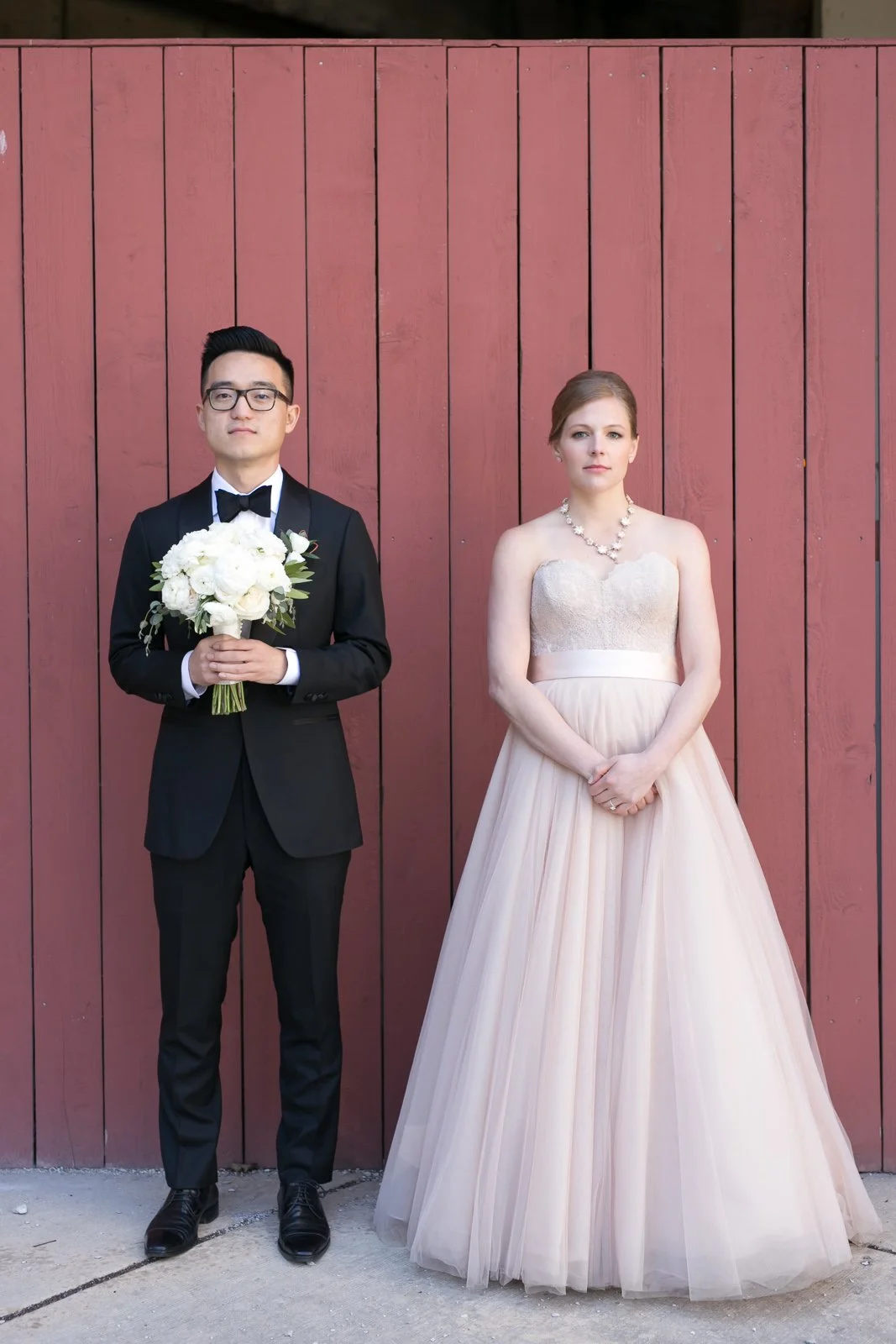 bride and groom standing on sidewalk michigan avenue wedding photography