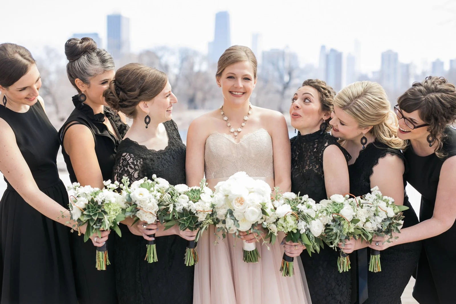 bride with bridesmaids portrait in chicago lincoln park pond wedding photography near me