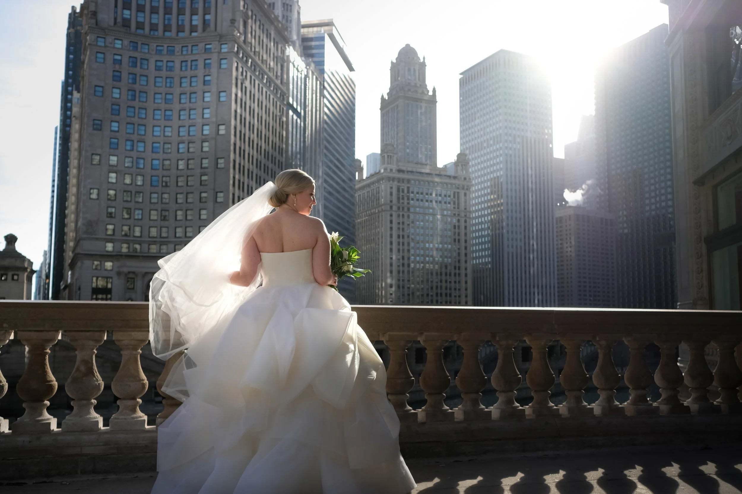 bride with bridesmaids Chicago downtown Wrigley Building wedding photography packages