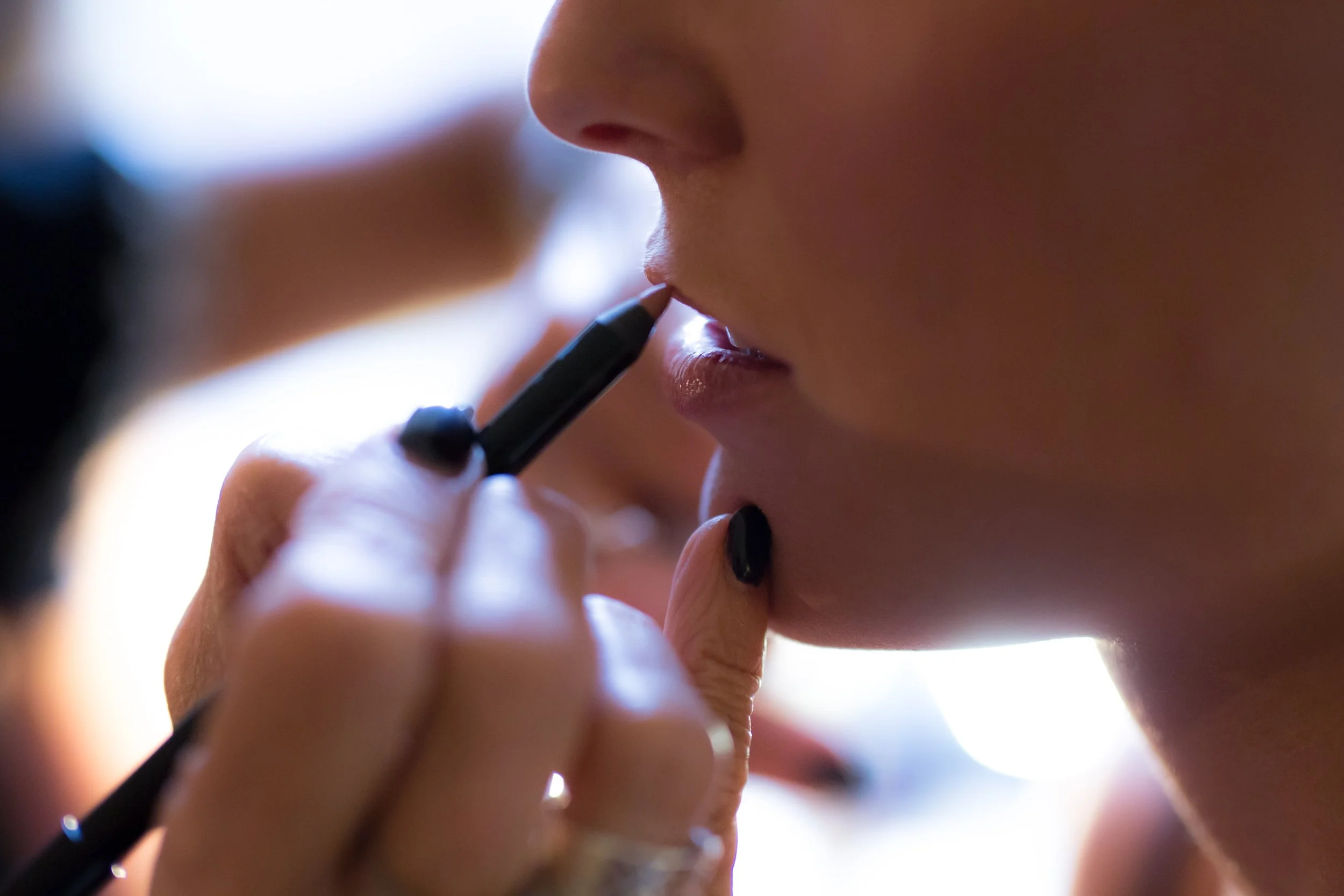 bride getting her makeup done Chicago wedding photographer near me