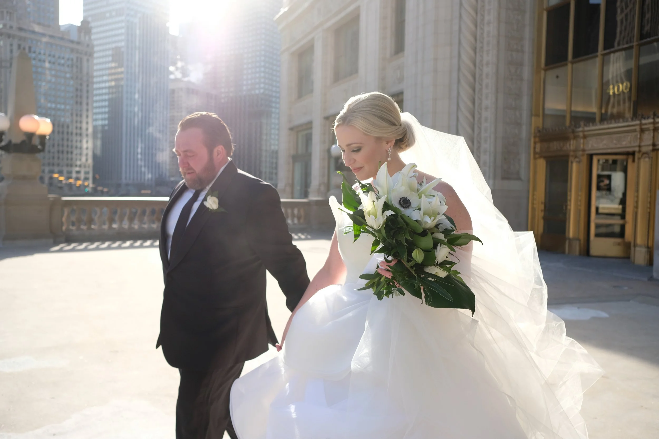 bride with groom Chicago downtown Wrigley Building wedding photography packages