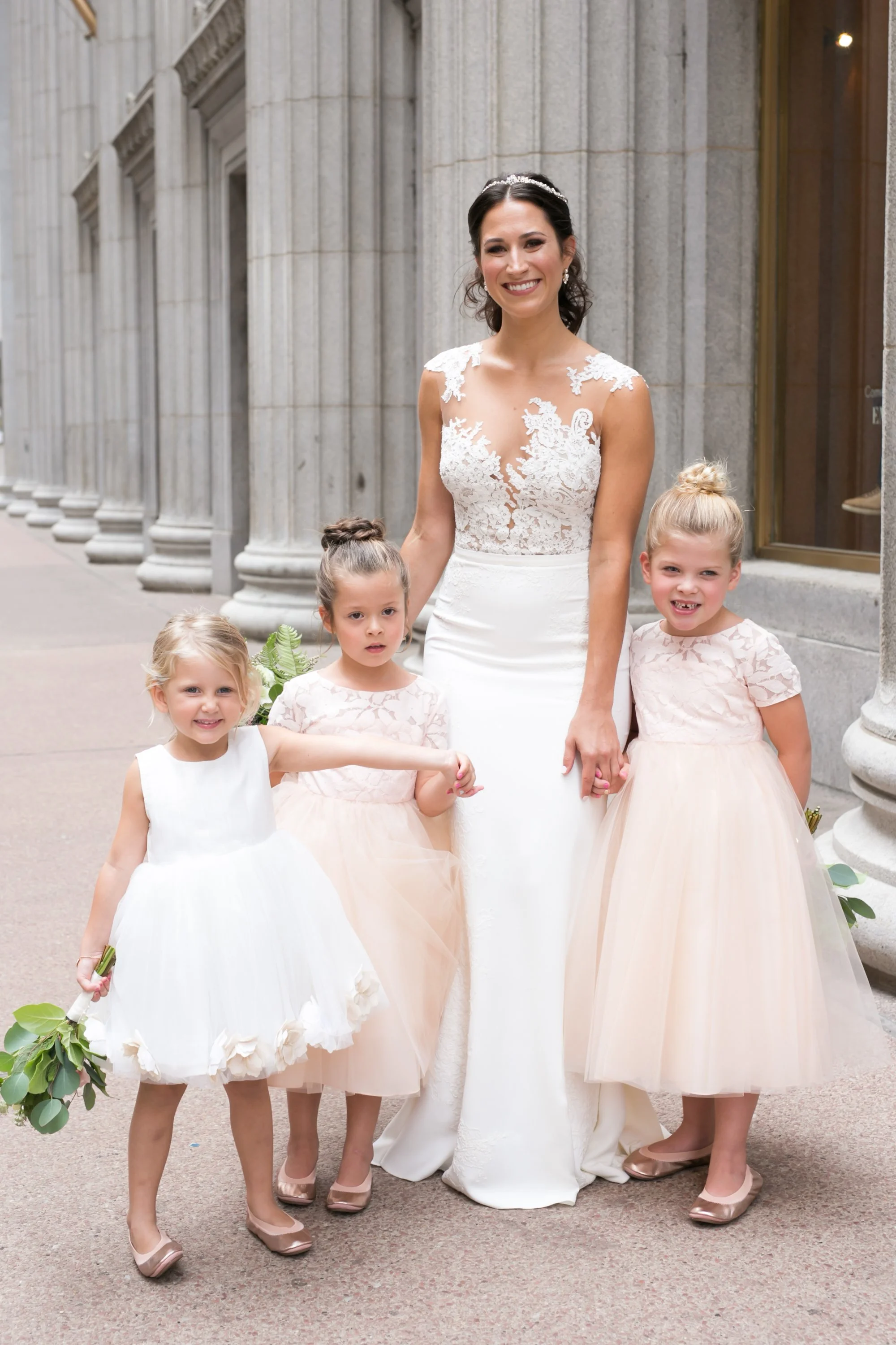 bride with flower girls with flowers wedding photographer in Chicago 