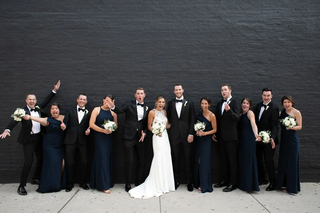 Full bridal party cheesing for the wedding photographer