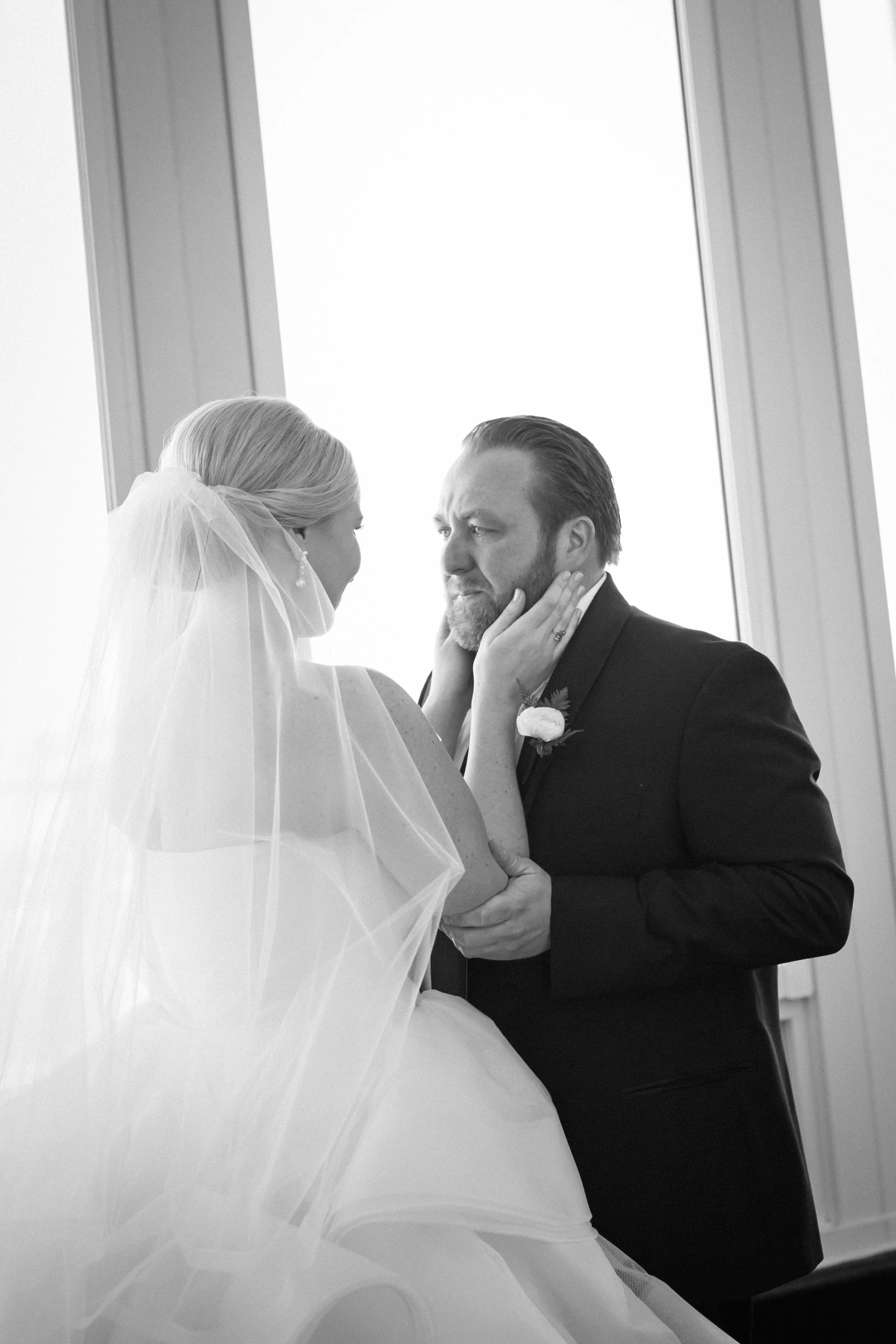 groom crying seeing bride for the first time wedding photographer near me 