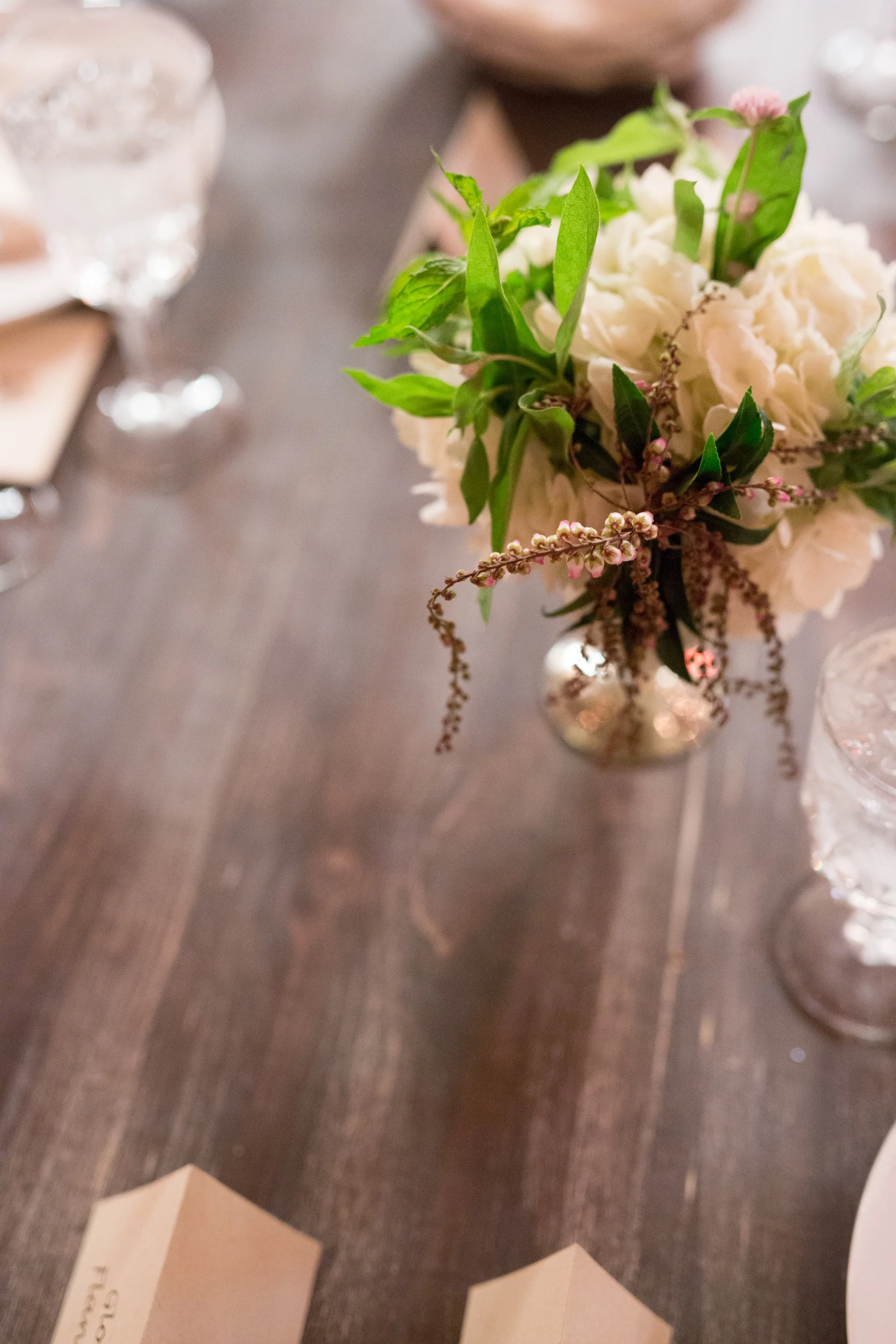 wedding reception table centerpieces with flowers wedding photographer near me