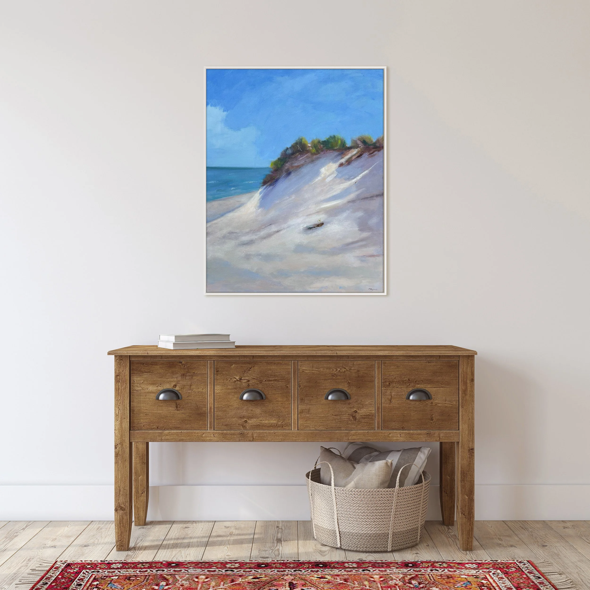 Framed oil painting of a sunny day on the South Shore of Nantucket on wall above table