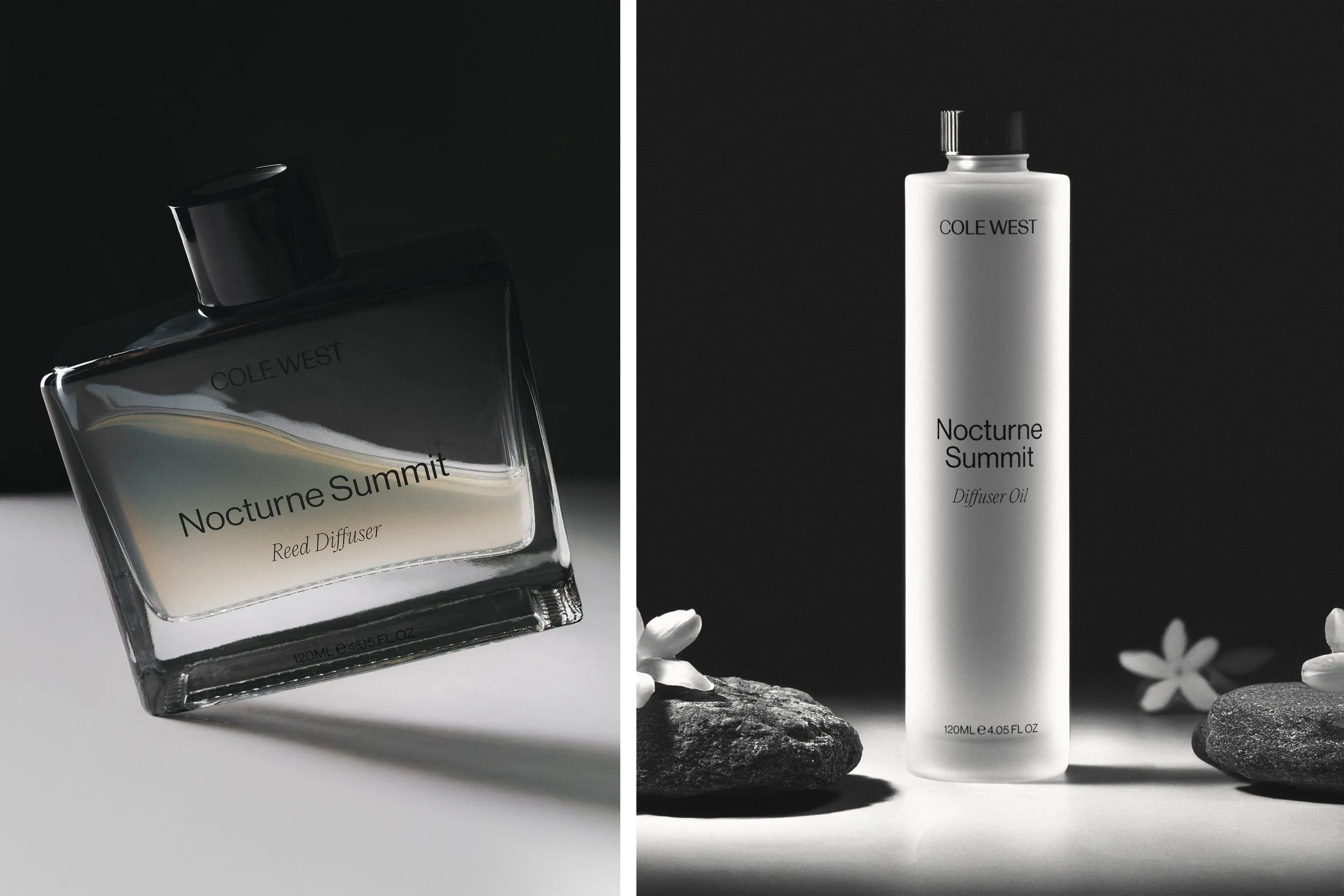Two bottles of Nocturne Summit Diffuser Oil by Cole West, one in a tilted glass container with liquid inside and the other in a white cylindrical bottle, surrounded by rocks and flowers against dark backgrounds.