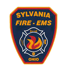 Sylvania Fire EMS Ohio badge with a fire symbol and firefighting equipment