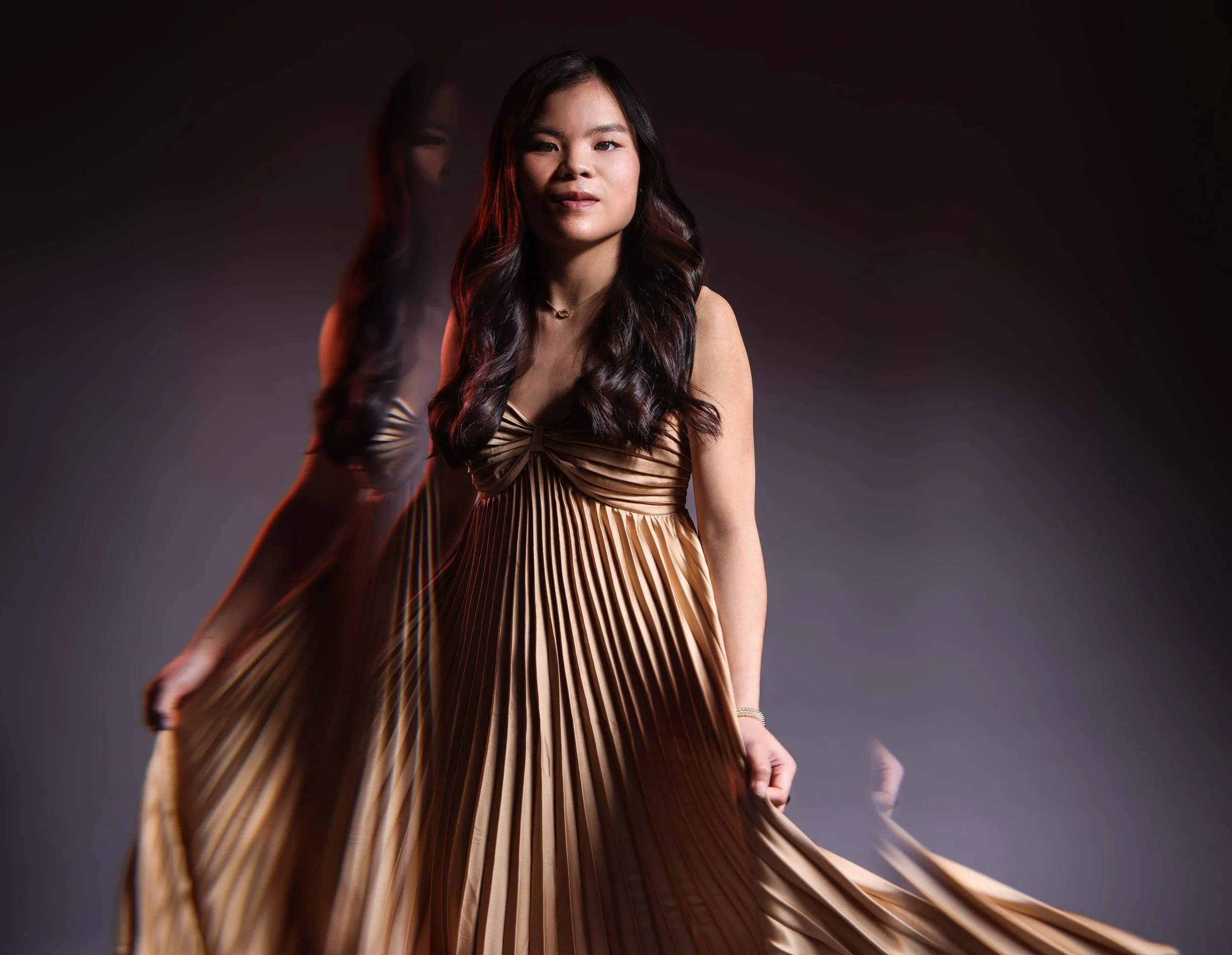 Creative Portrait of an Asian American Woman wearing a gold dress
