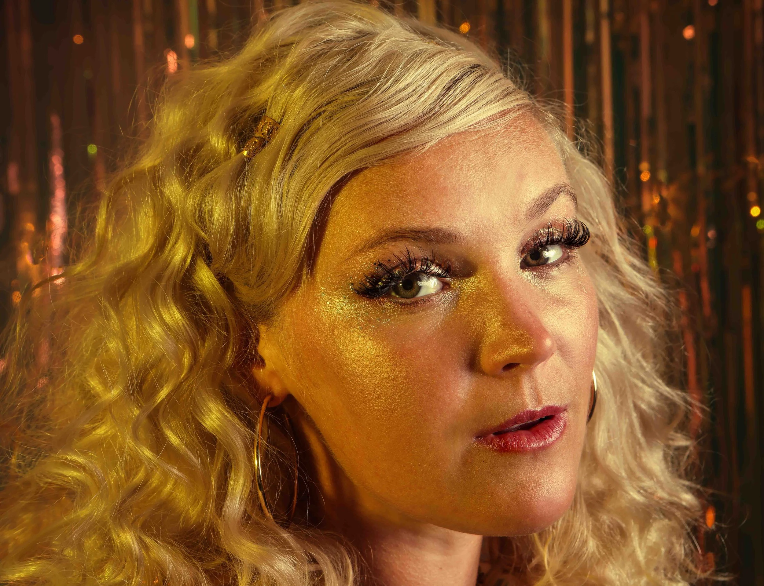 Closeup image of a woman with blond hair during a fashion photo shoot