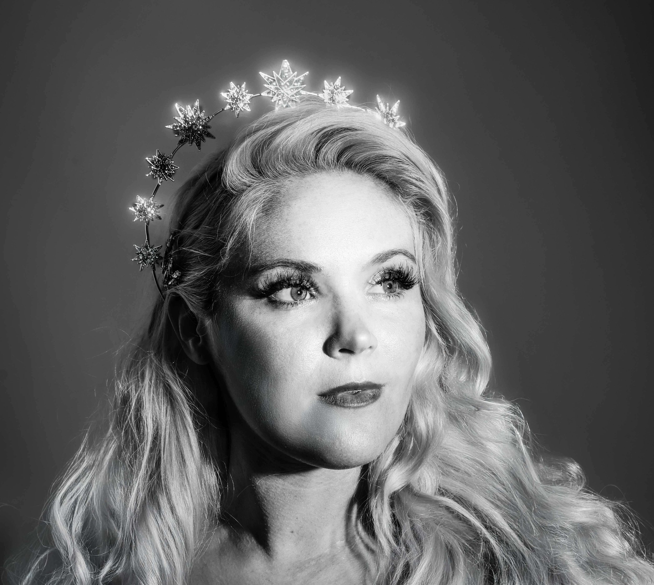 Woman with crown posing during fashion photo shoot in northwest arkansas 