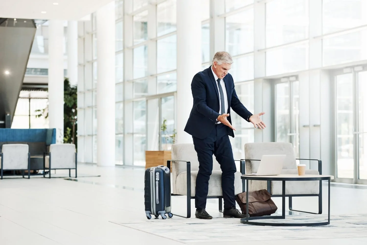Business traveler handling a disruption during a work trip