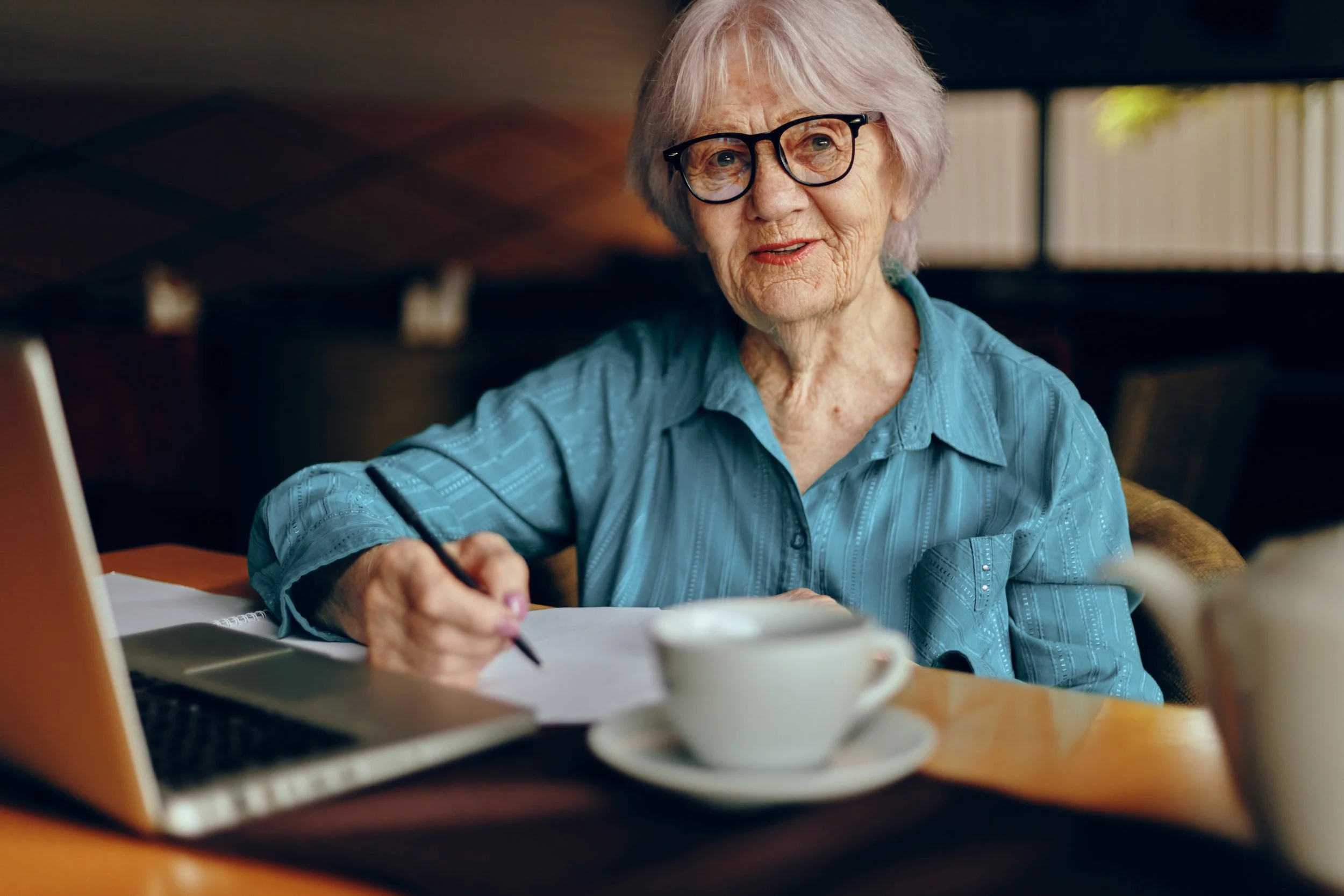 vecteezy_elderly-woman-documents-work-sheet-of-paper-and-pen-retired_25027663.jpg