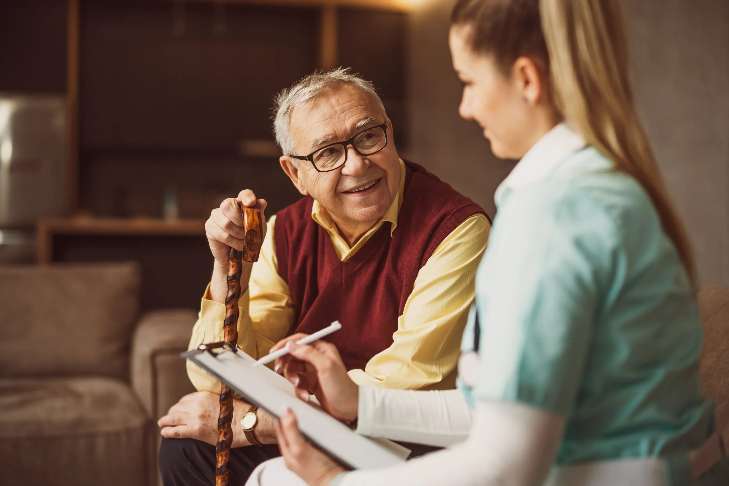vecteezy_elderly-man-with-female-caretaker-at-home-health-concept_23572745.jpg