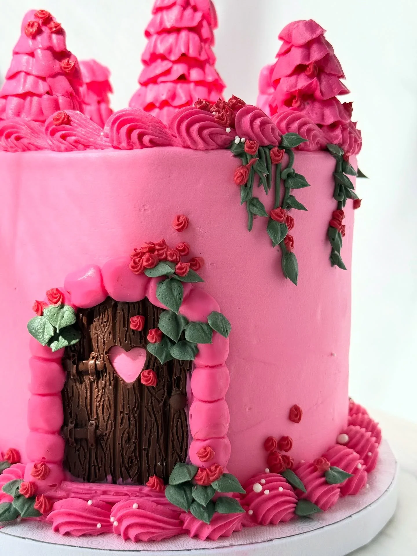 Princess Castle Cake 🏰

✨I used ice cream cones cut to different heights for the spires of the castle 

✨the trick is to cut the cones slowly with a serrated knife so they don&rsquo;t crack 

✨I used petal tip 104 to create a ruffle effect around th