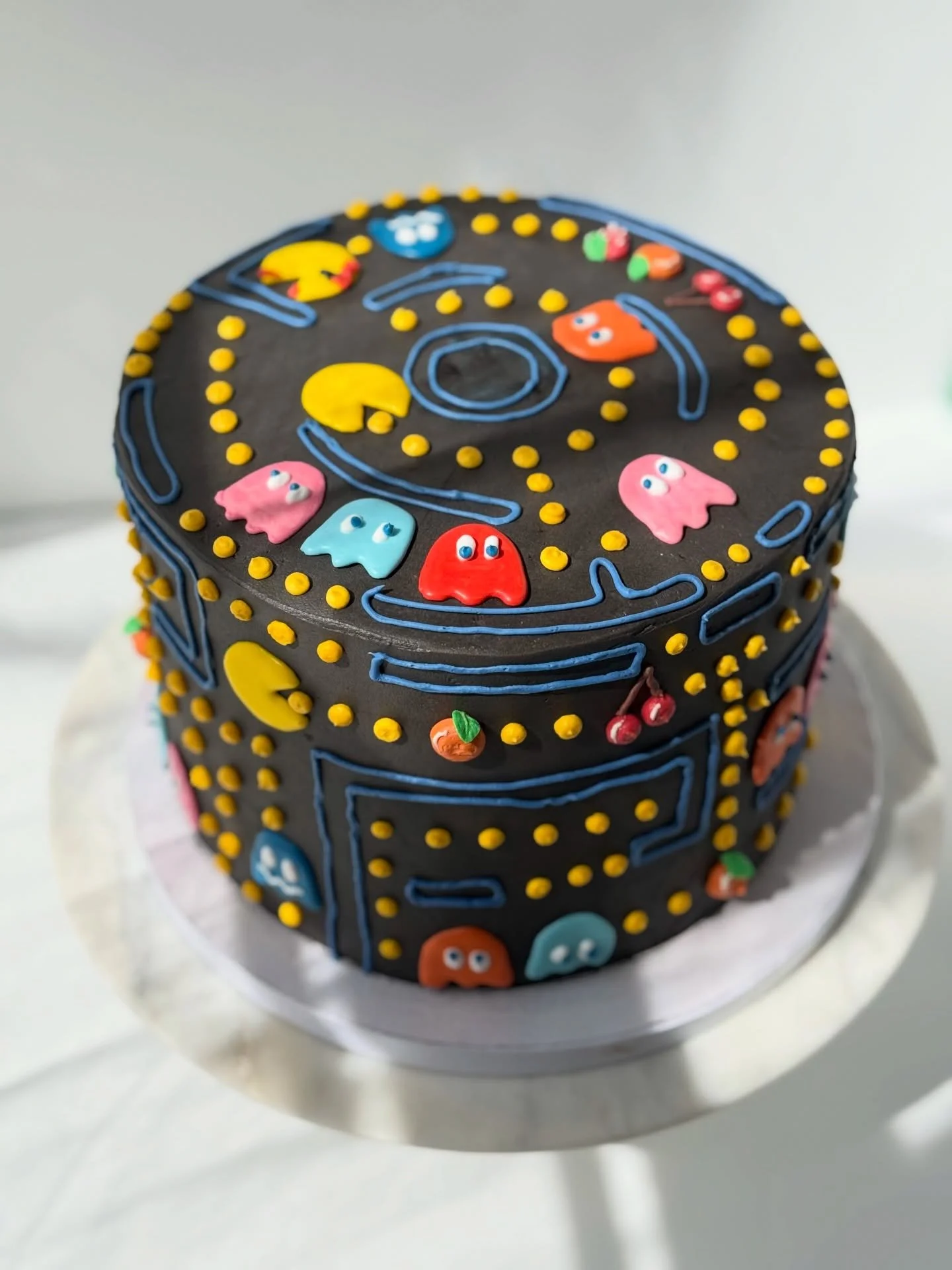 Pac-Man Cake 🟡

✨this cake started with the flavor. We needed black cocoa for the buttercream to help dye it and not stain everyone&rsquo;s teeth

✨all the pac man and other cuties (not sure what they&rsquo;re called) are made of royal icing transfe