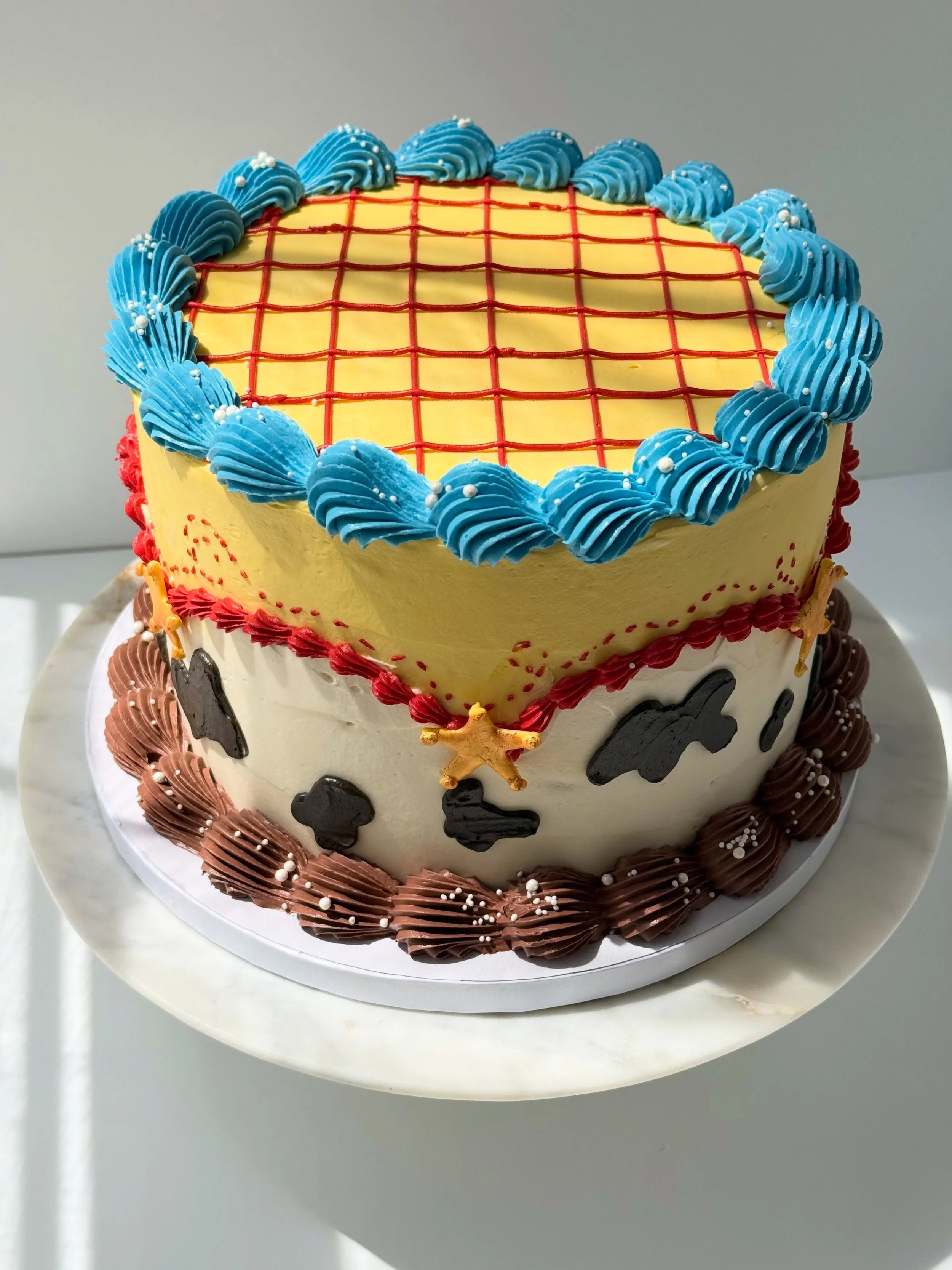 Toy Story Cake ✨

✨In honor of the new Toy story movie coming out later this month 

✨I don&rsquo;t make character cakes so this is the closest we will come 

✨everything is buttercream except for the gold stars that are royal icing painted with edib