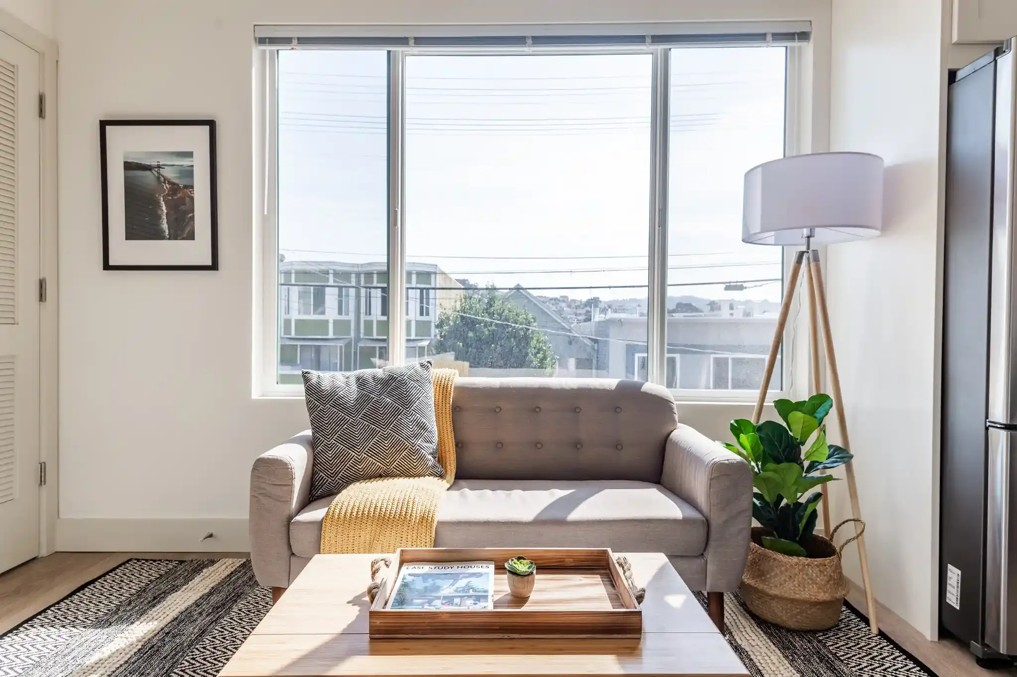 Living room with modern sofa and large window in San Francisco ADU