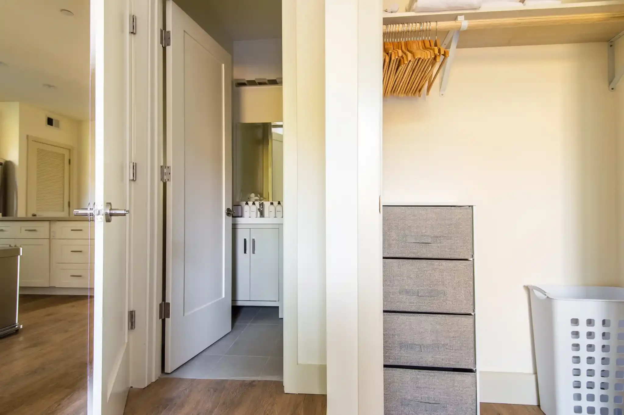 View from bedroom to kitchen, showcasing open floor plan in newly converted duplex