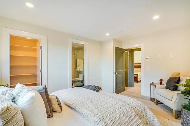 Structural layout changes creating flexible guest room with added door openings
